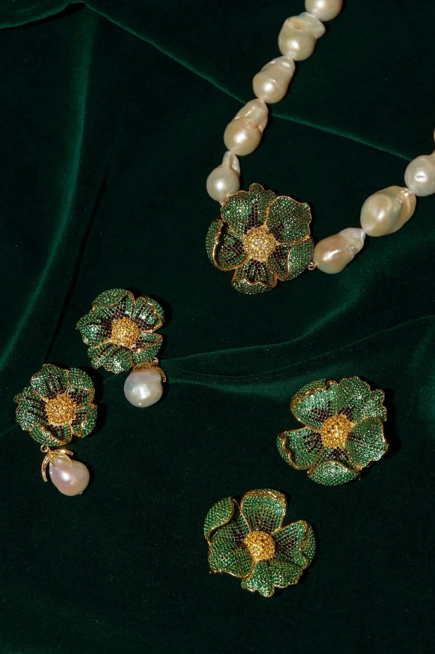 Poppy Flower Baroque Pearl Necklace Emerald Green Gold worn by a model, showing the pendant scale and how the chain sits.