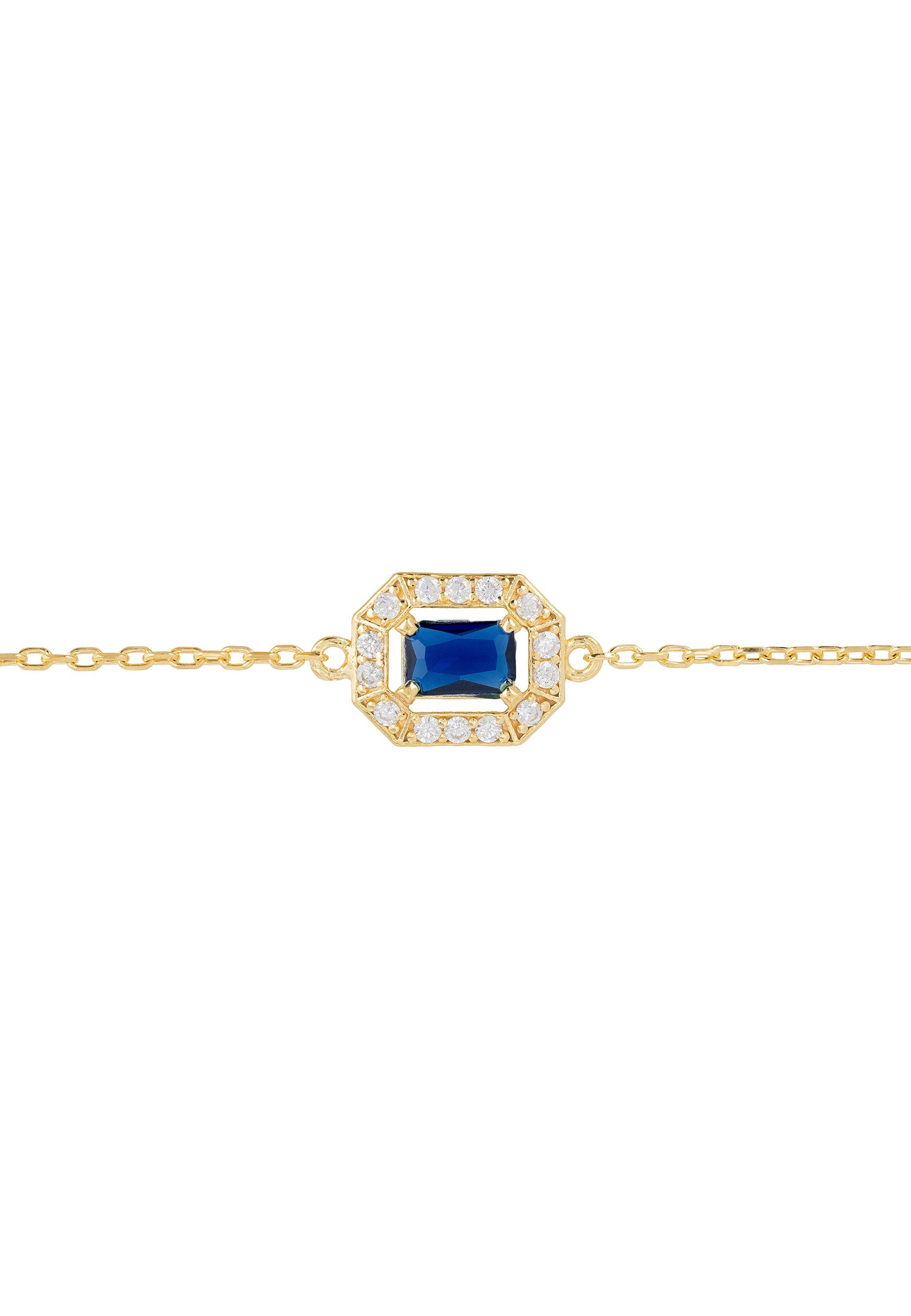 Gold bracelet with a blue gemstone and diamond accents on a white background