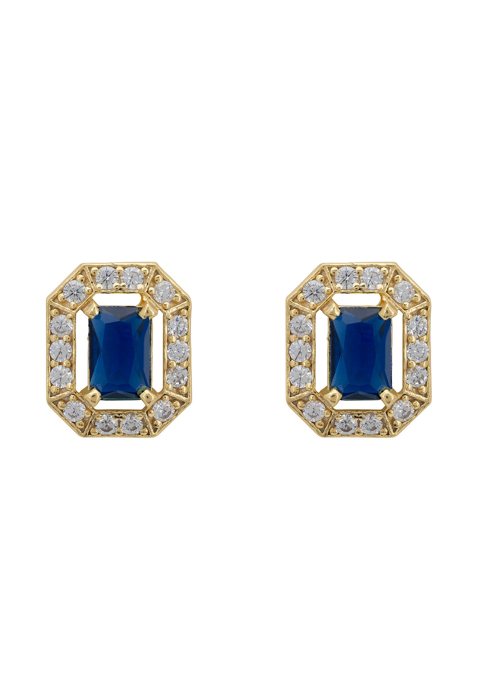 Pair of gold earrings with blue gemstones on a white background