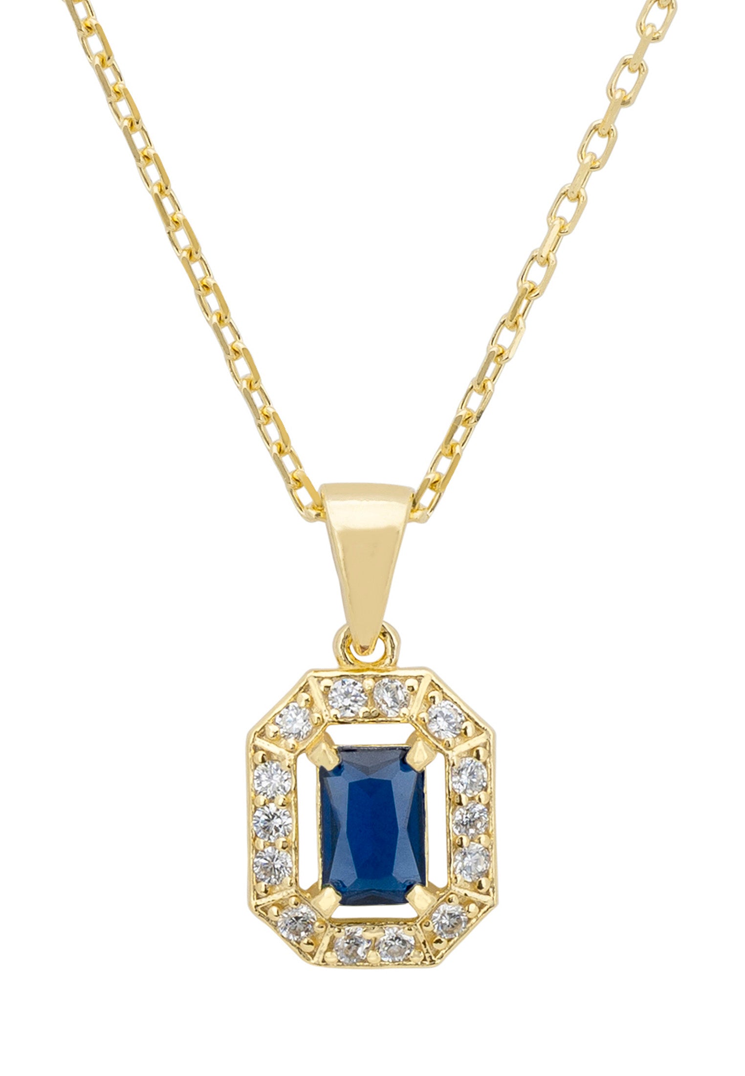 Gold pendant necklace with a blue gemstone and clear stones on a white background