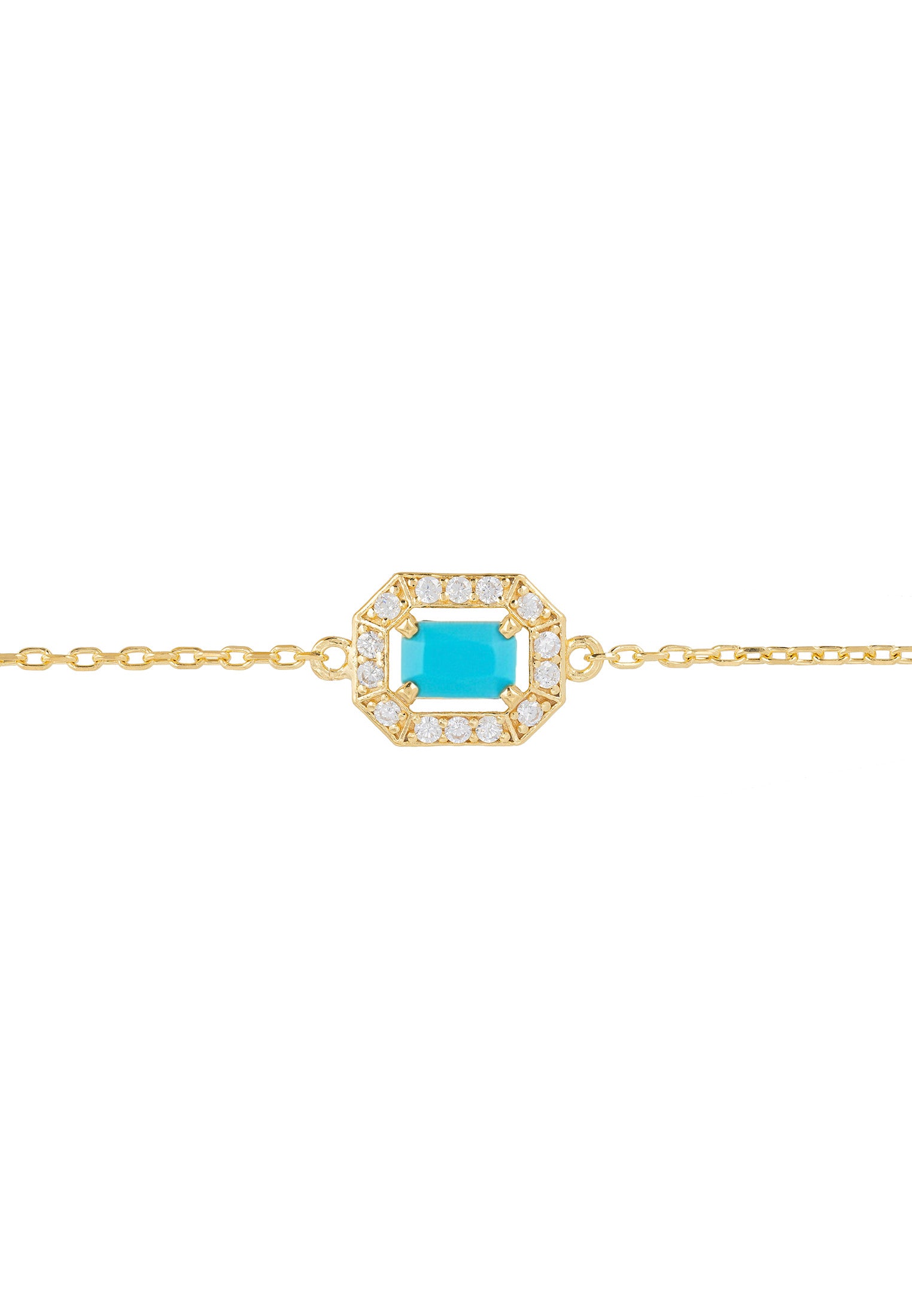 Gold bracelet with a turquoise stone and diamond accents on a white background