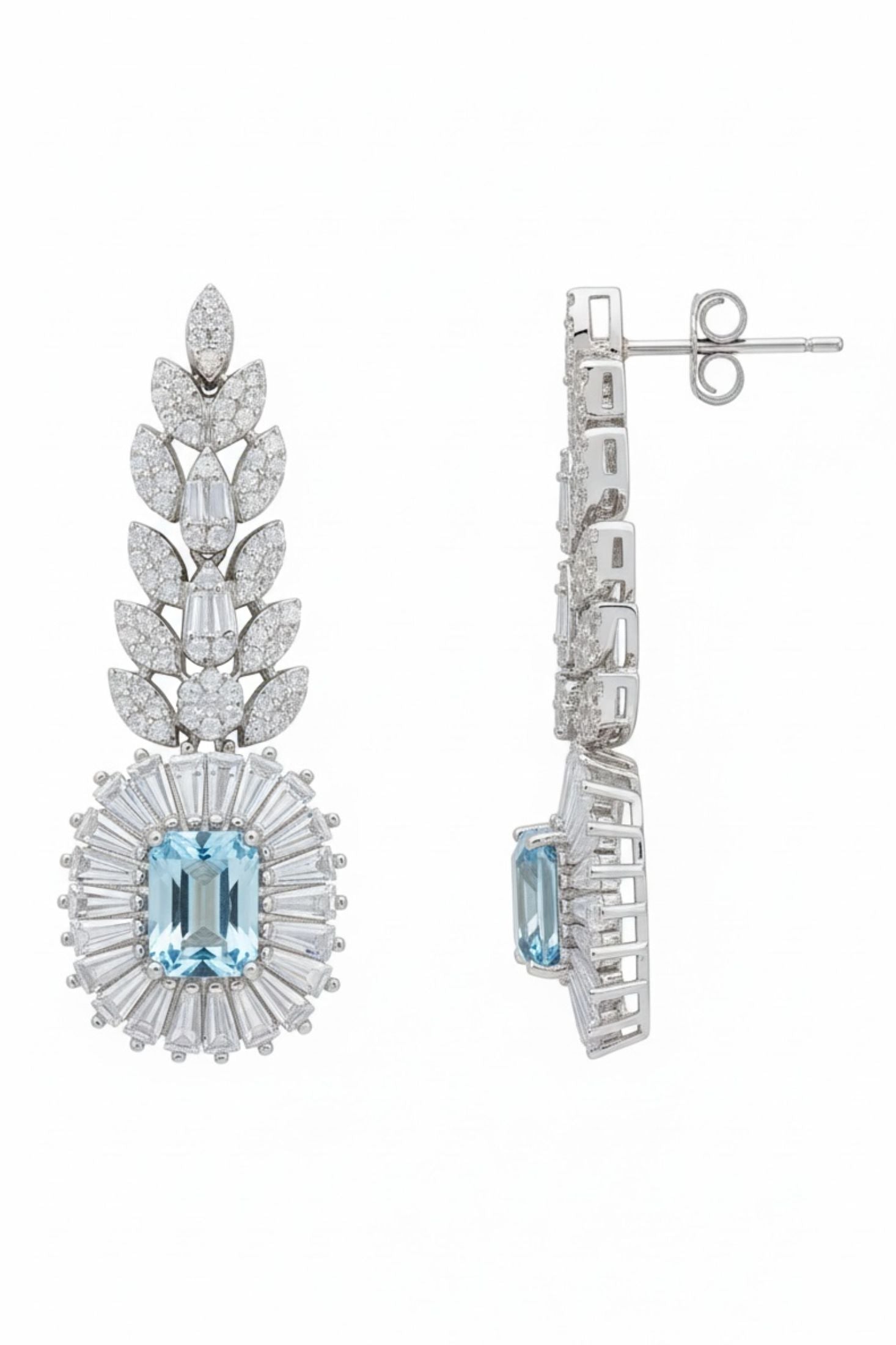 Elegant silver earrings with blue gemstones on a white background