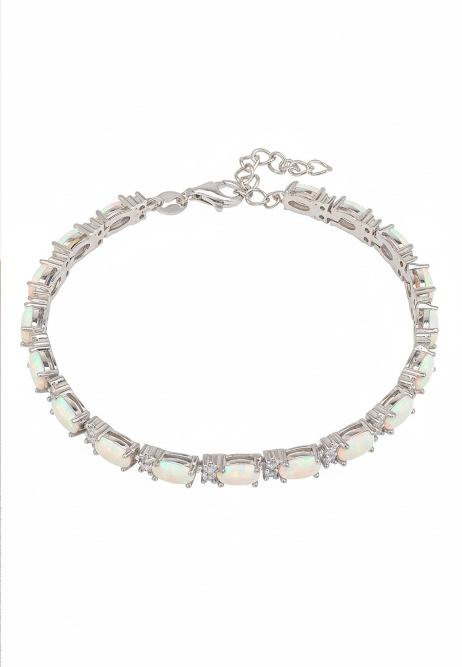 Silver bracelet with opal stones on a white background