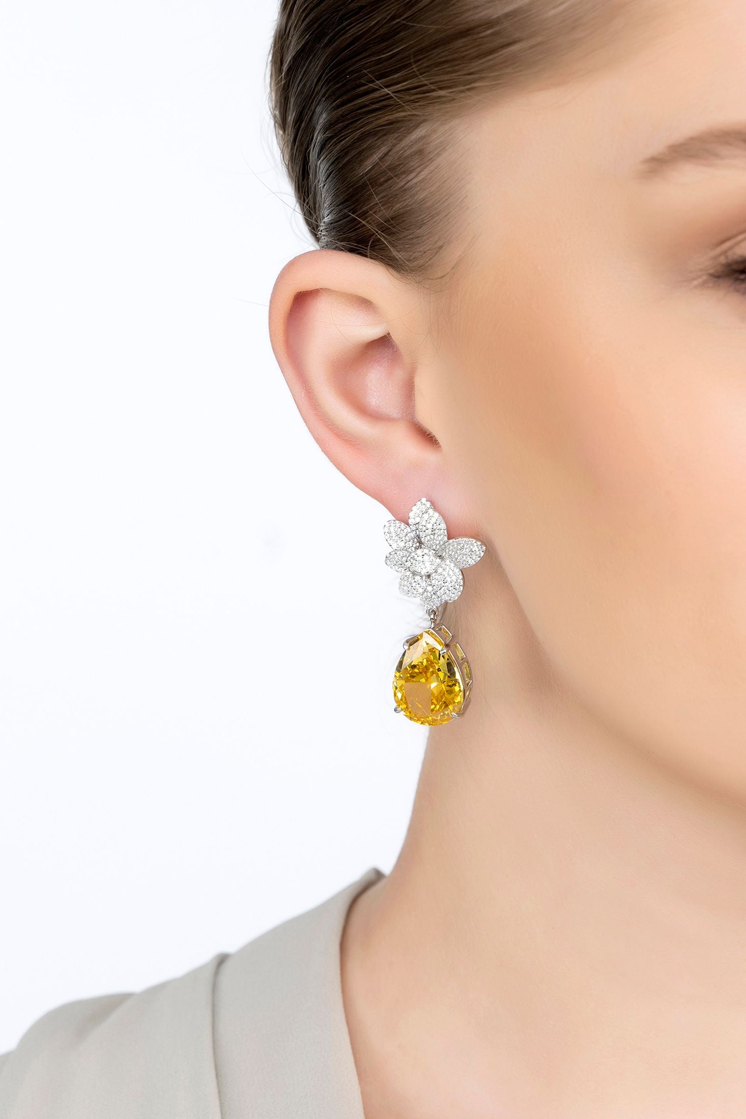 The earring worn by a model.