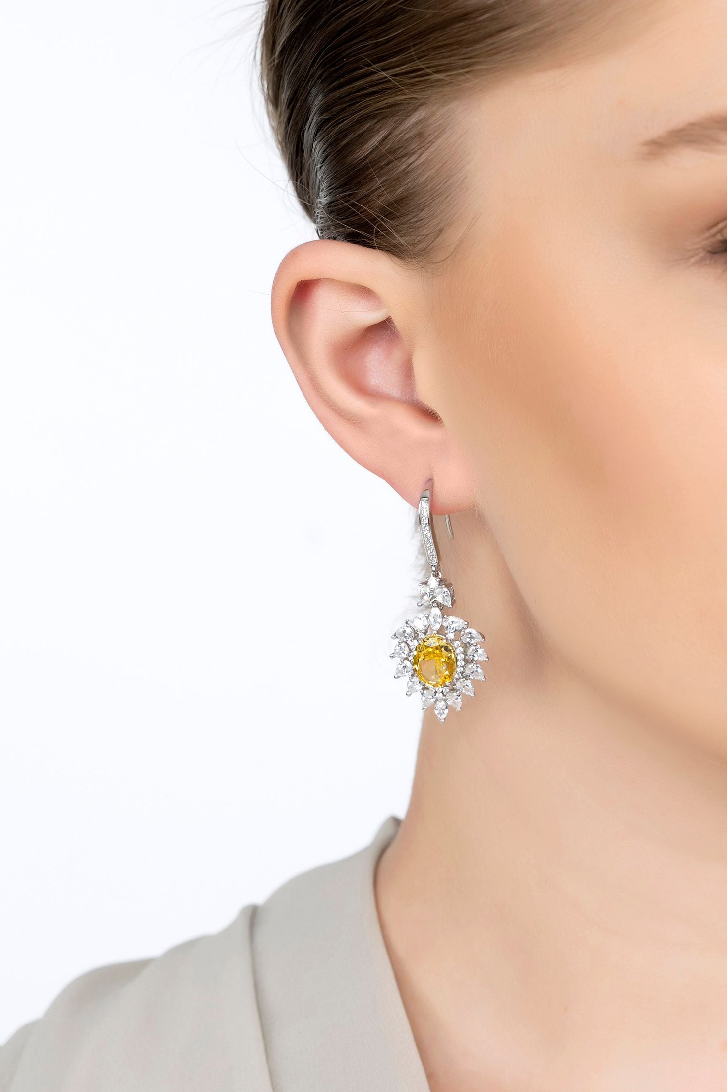 The earring worn by a model.