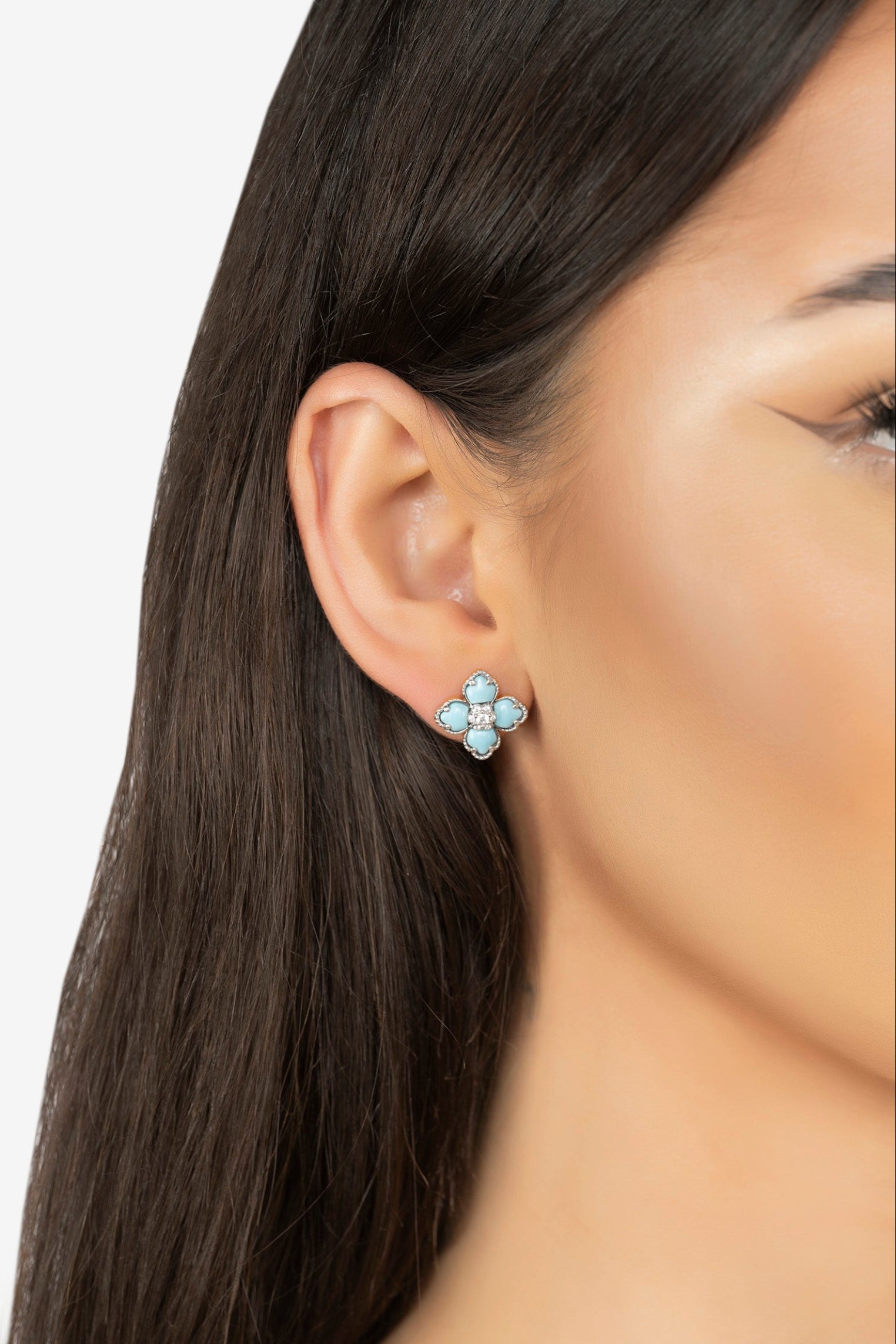 The earring worn by a model.