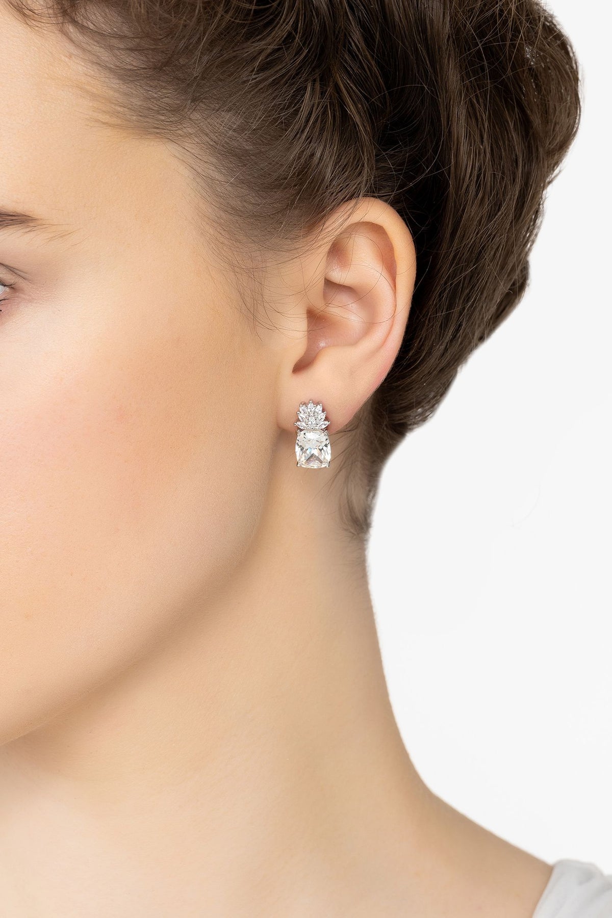 Angled view of Pineapple Gemstone Earrings Moissanite Silver, showing silver finish and the jewellery profile.