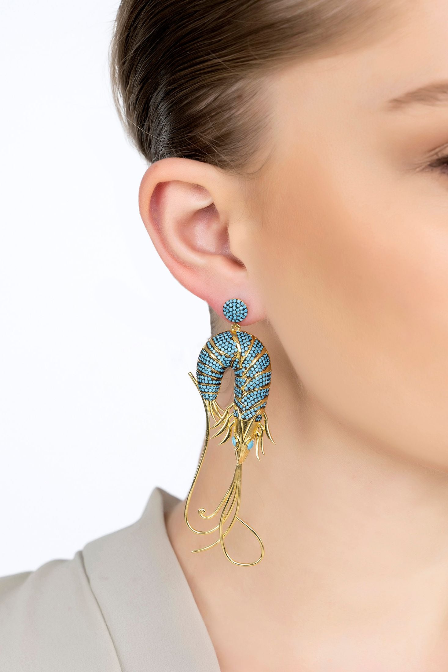 The earring worn by a model.