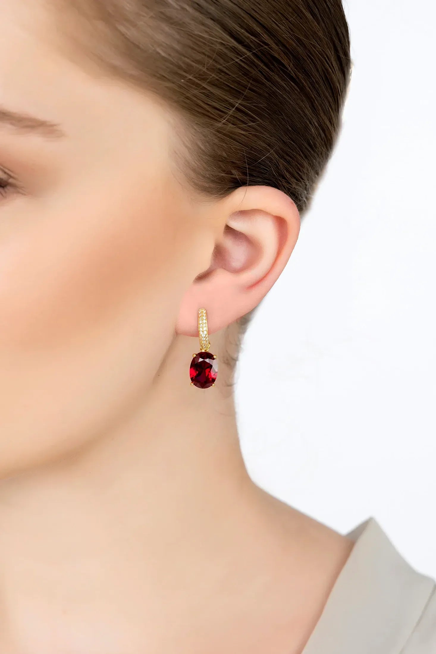 The earring worn by a model.