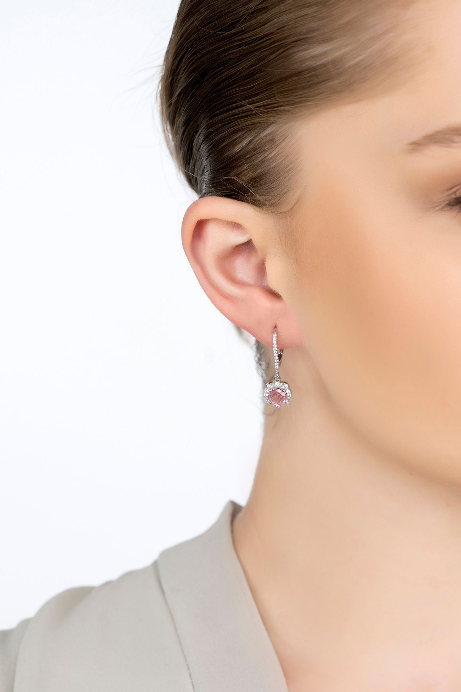 The earring worn by a model.