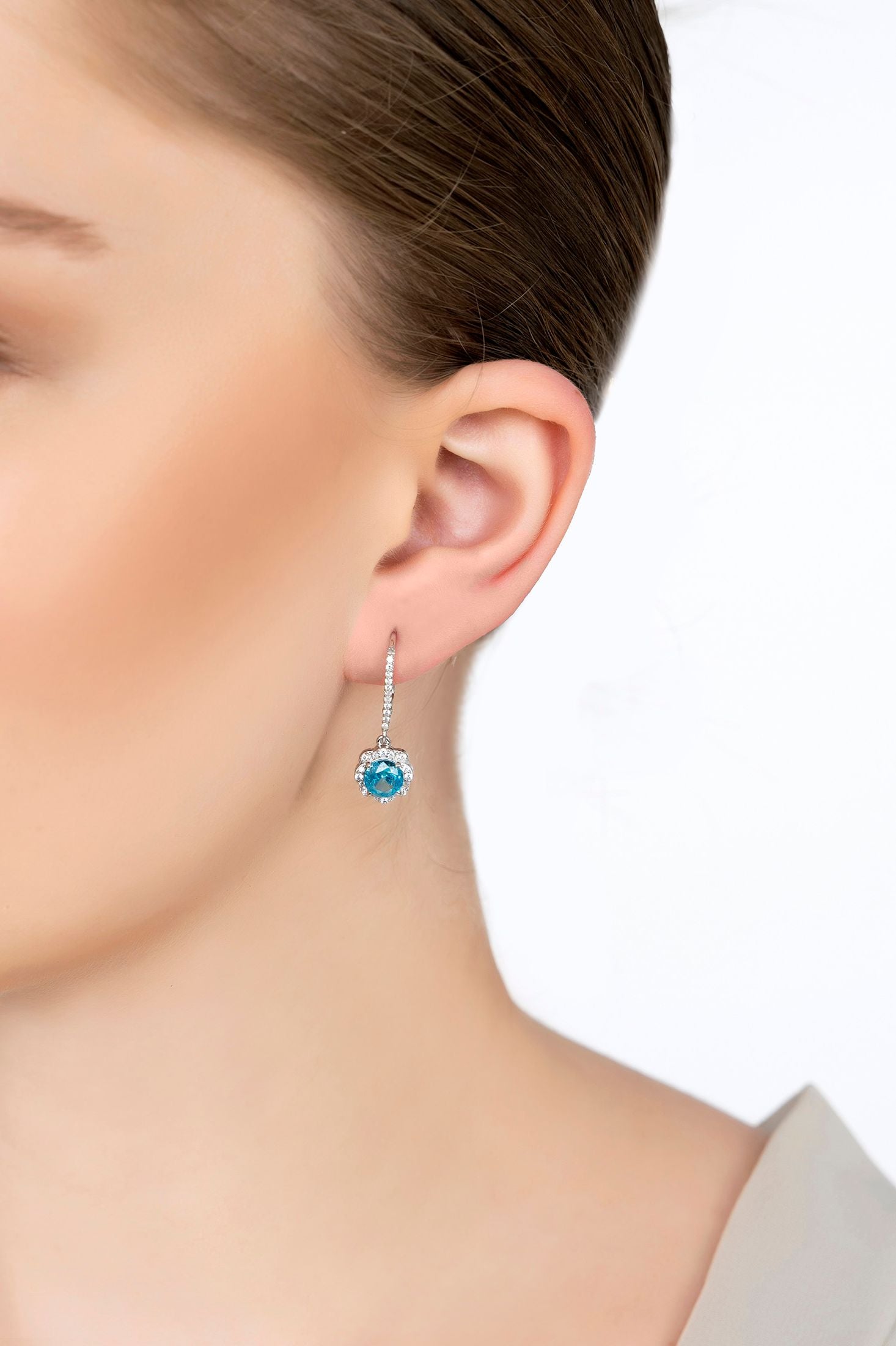 The earring worn by a model.