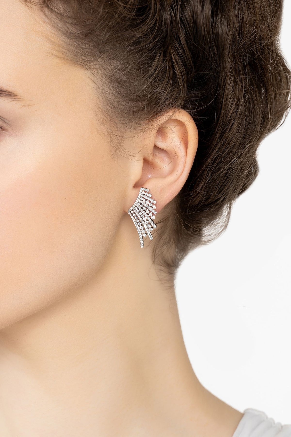 Angled view of Aniela Angel Wing Ear Climbers Silver, showing silver finish and the jewellery profile.