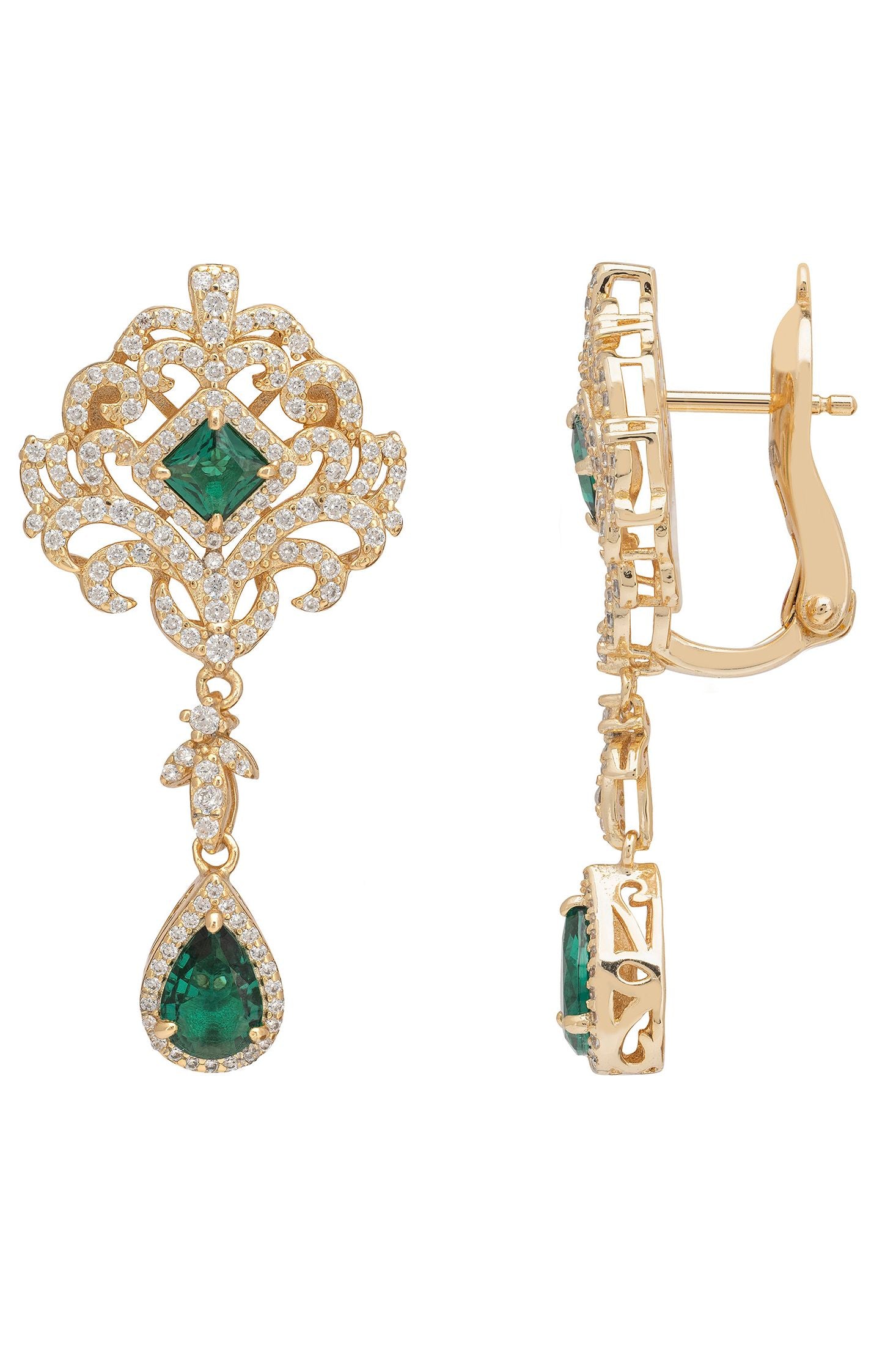 Gold earrings with green gemstones on a white background