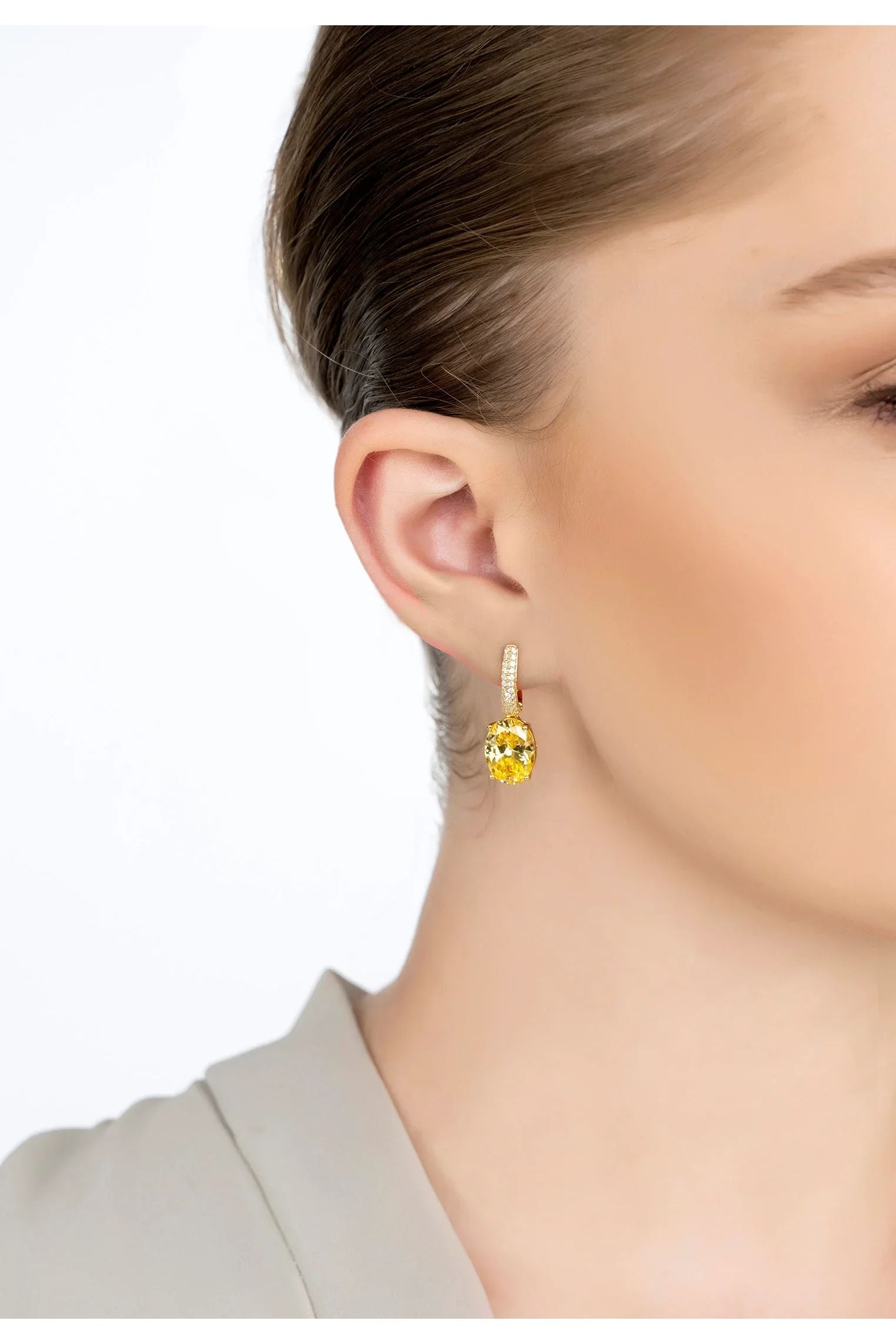 The earring worn by a model.