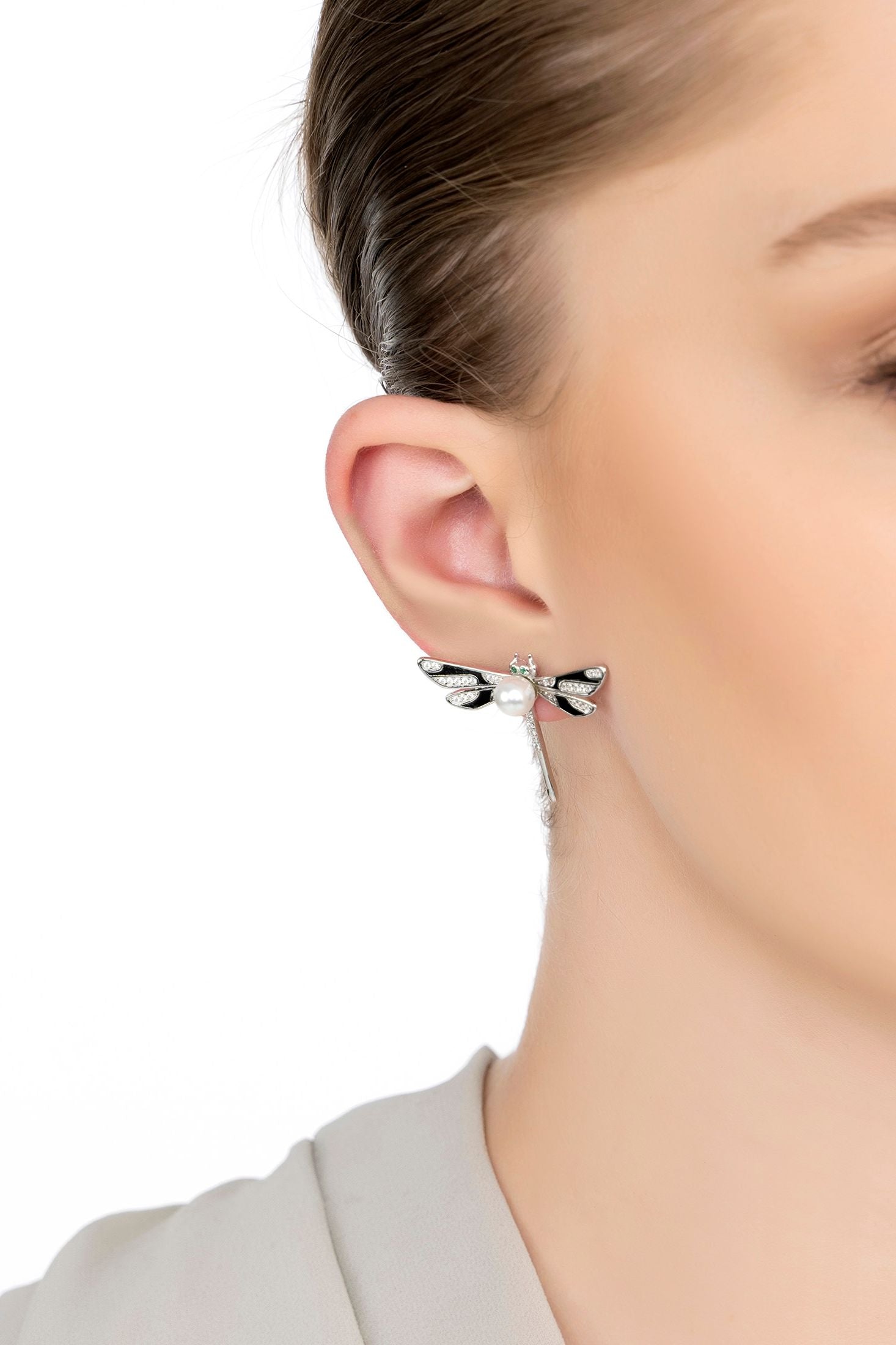 The earring worn by a model.