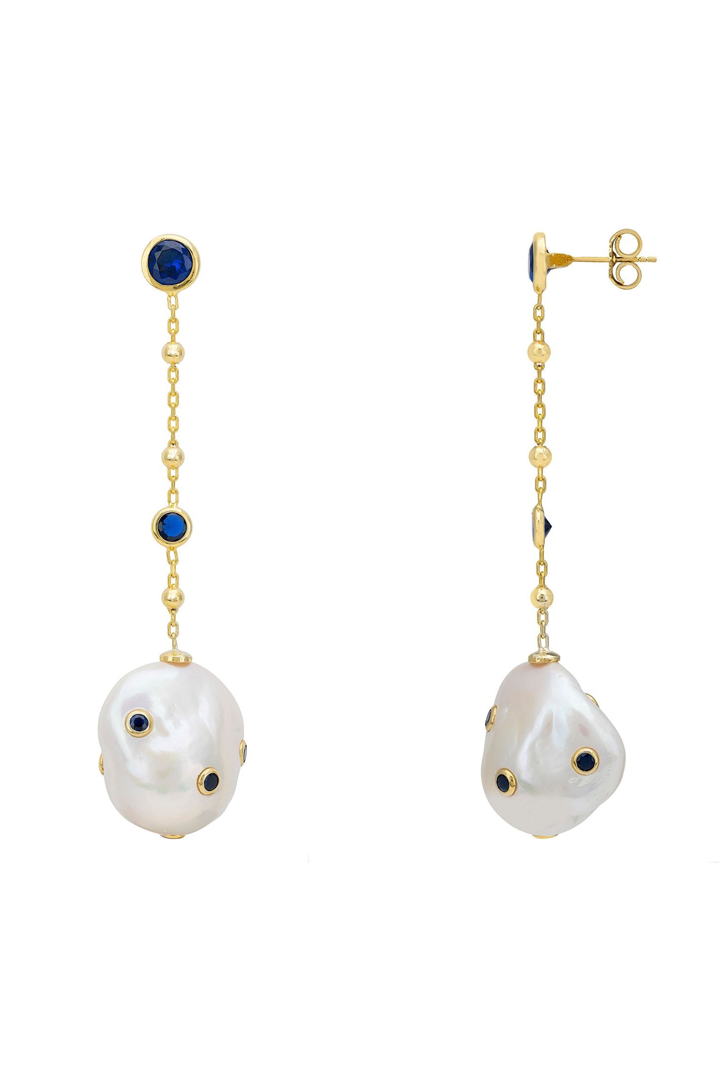 Angled view of Polka Dot Baroque Pearl Chain Drop Earrings Gold Sapphire, showing baroque pearl and pearl detailing, gold finish and the jewellery profile.
