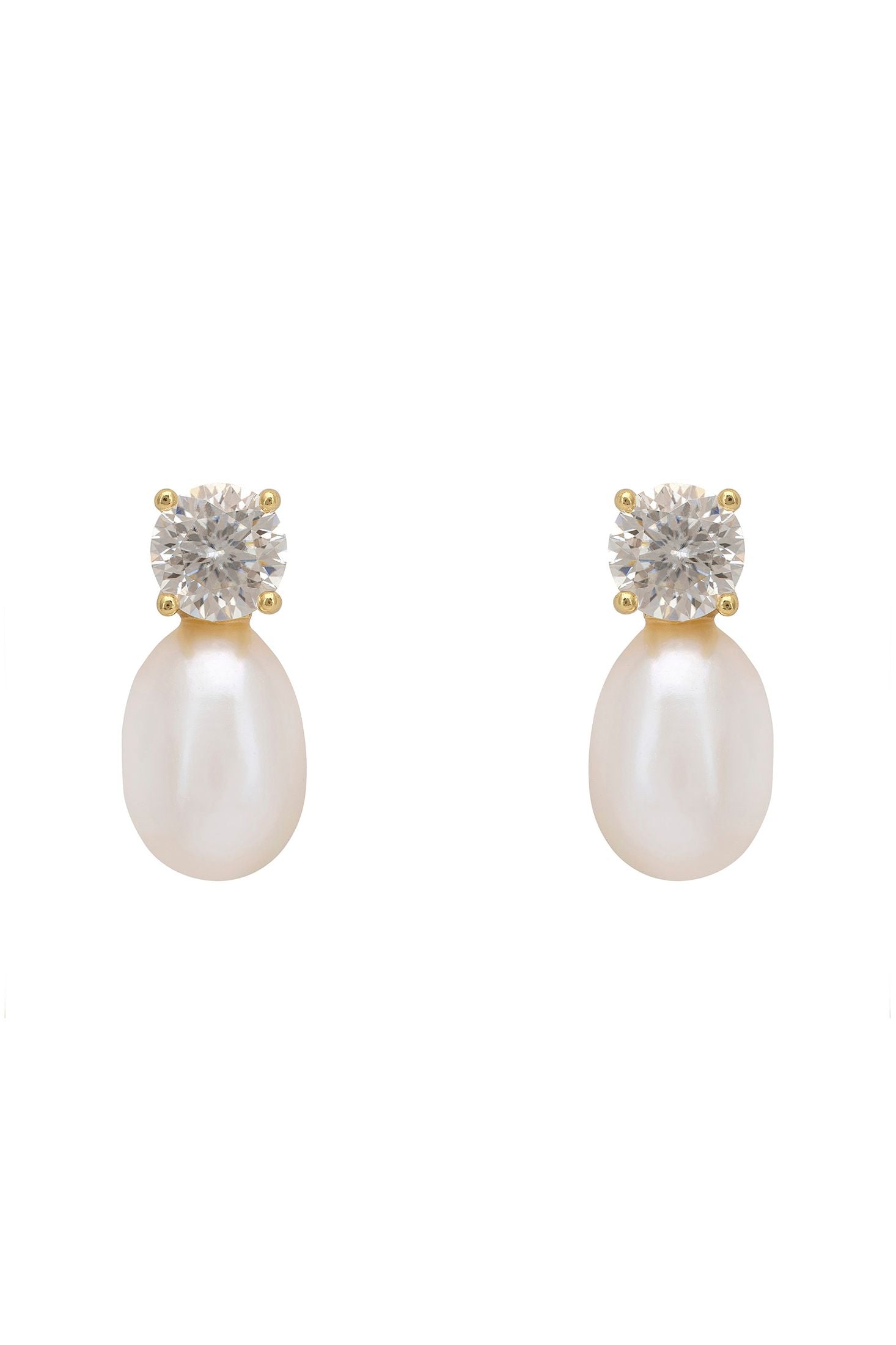 Pair of pearl earrings with diamond-like stone tops on a white background