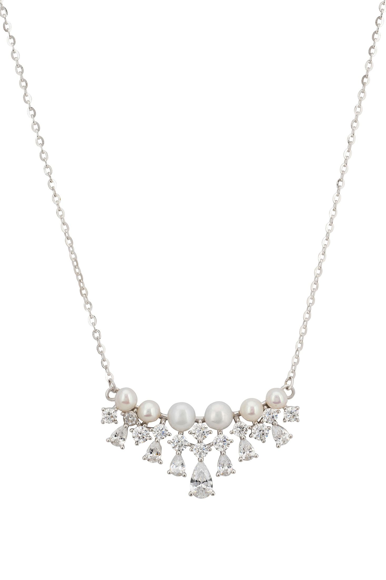 Close-up of the pearl and diamond lace motif charm.