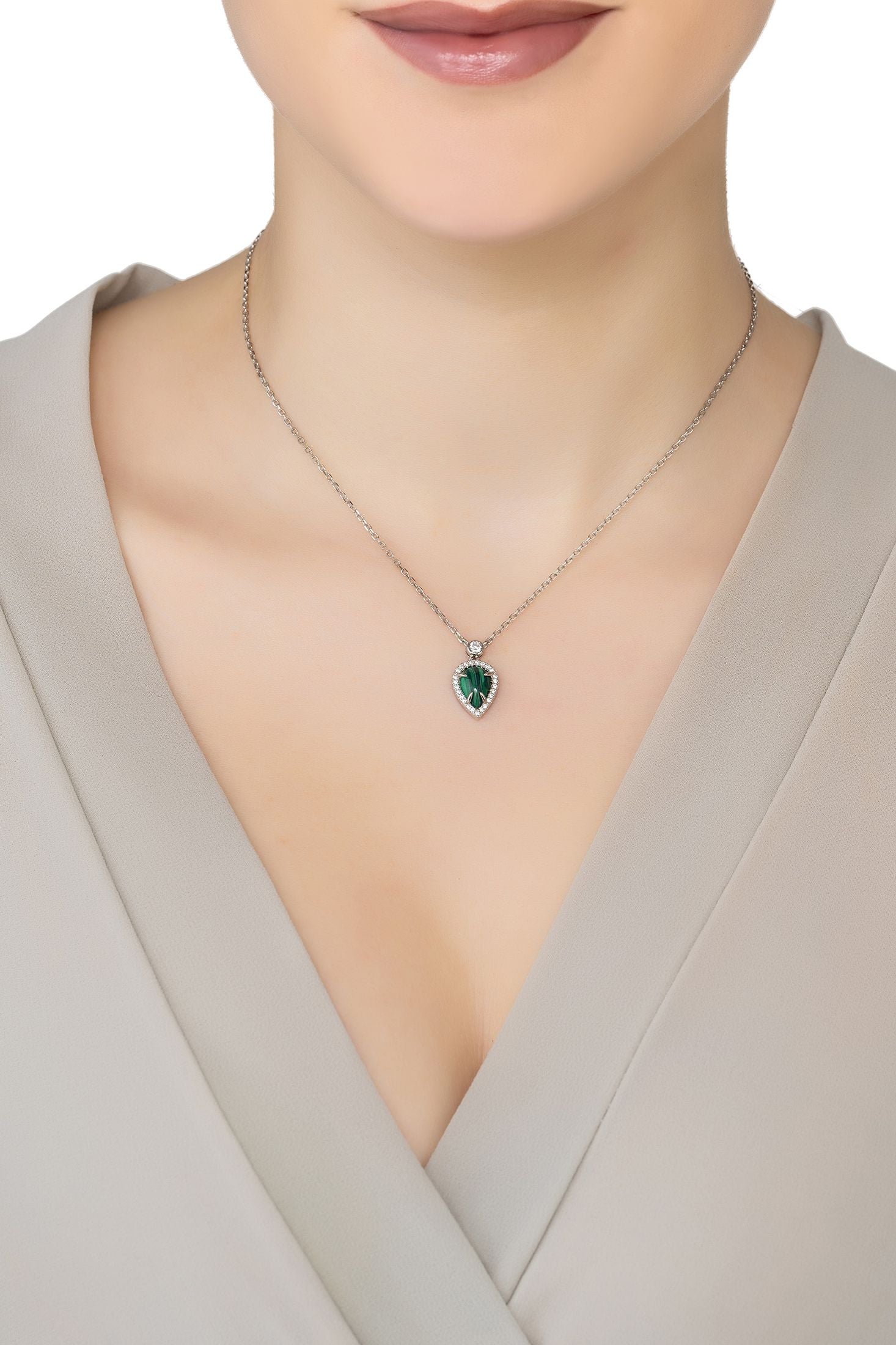 Angled view of Arrowhead Malachite Gemstone Pendant Necklace Silver, showing malachite detailing, silver finish and the jewellery profile.