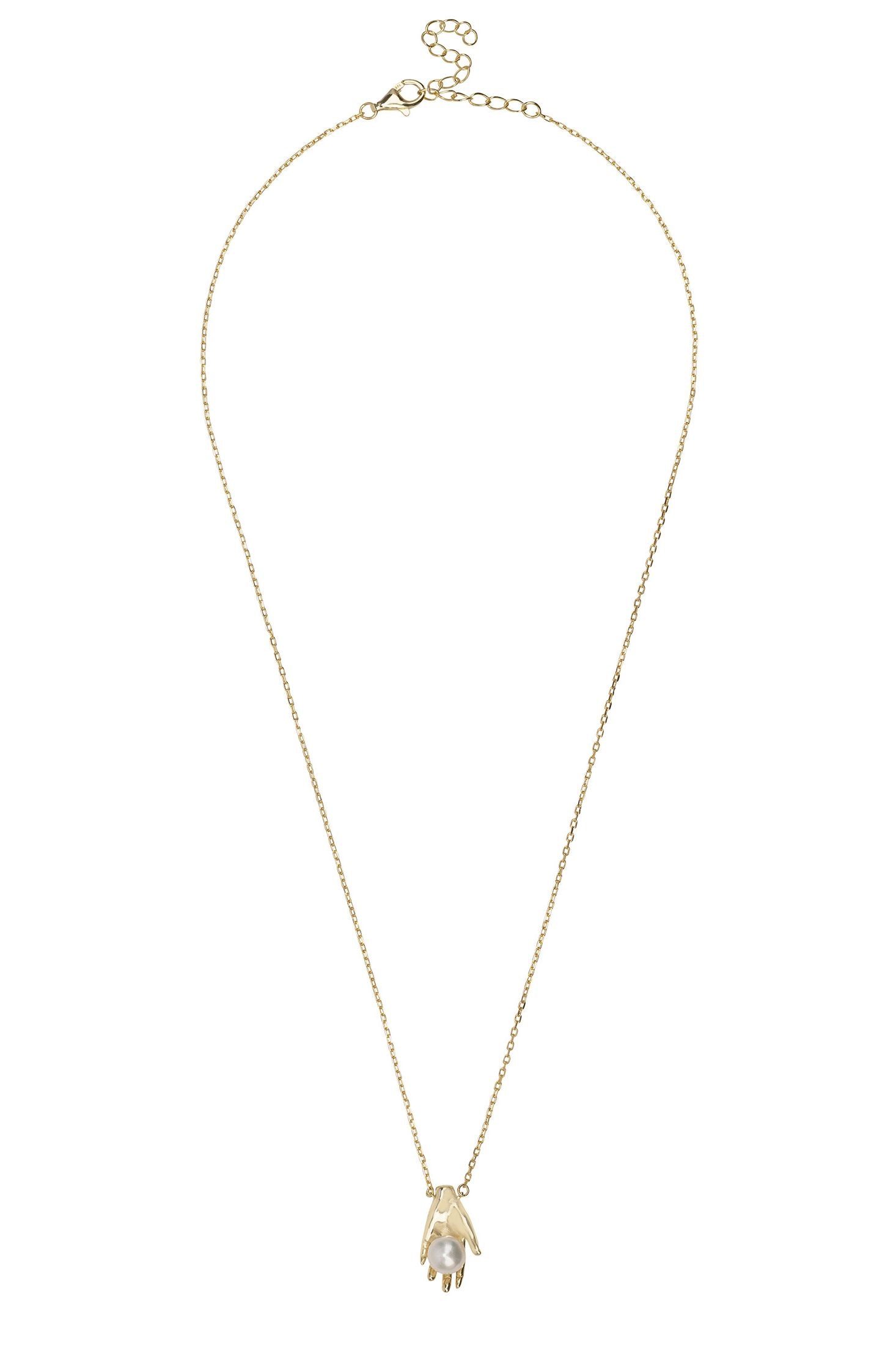Gold necklace with a small pendant on a white background