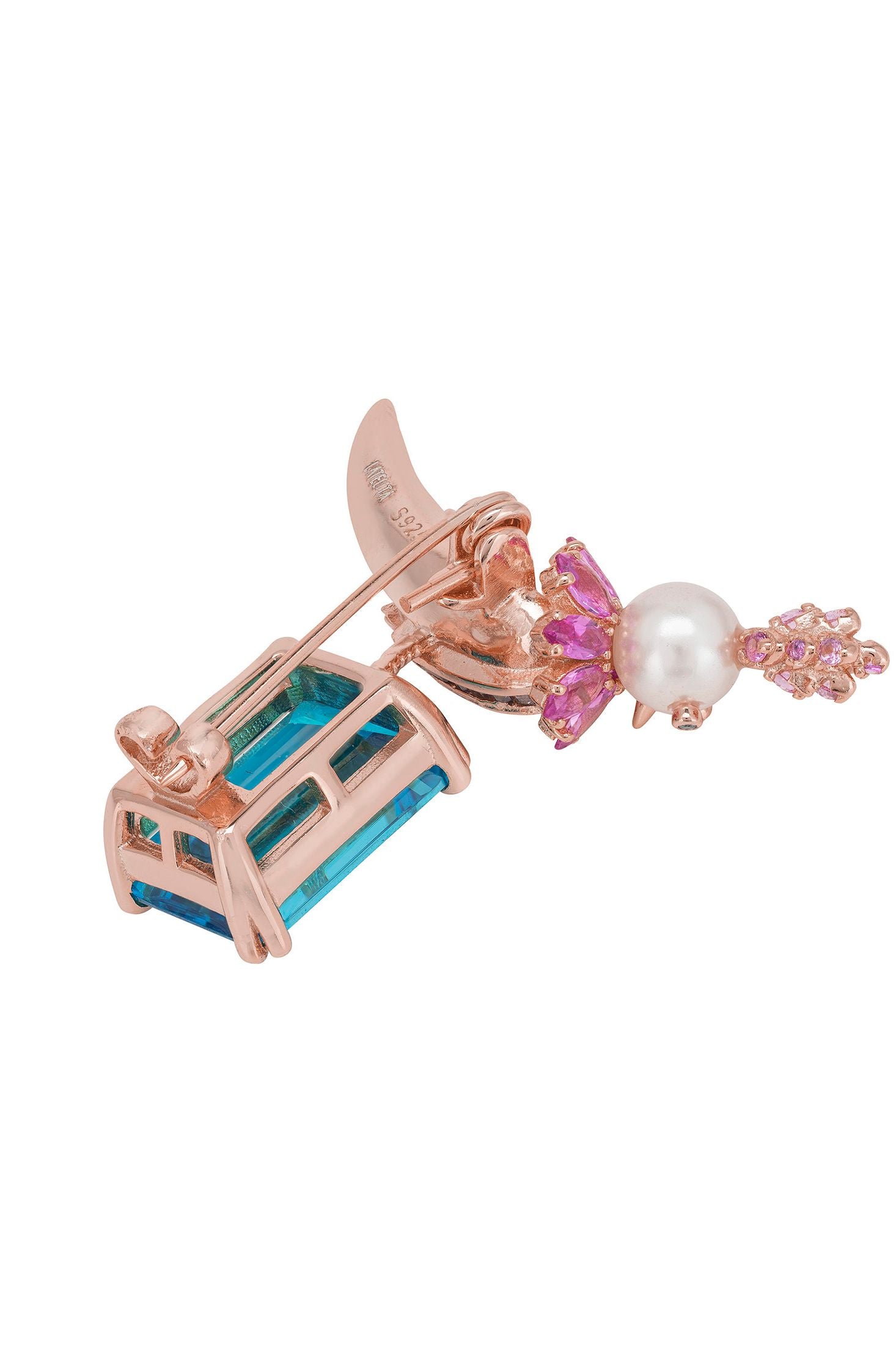 Angled view of Bird Of Paradise Pearl Brooch Blue Topaz Rose Gold, showing bird design, pearl and blue topaz detailing, rose gold finish and the jewellery profile.