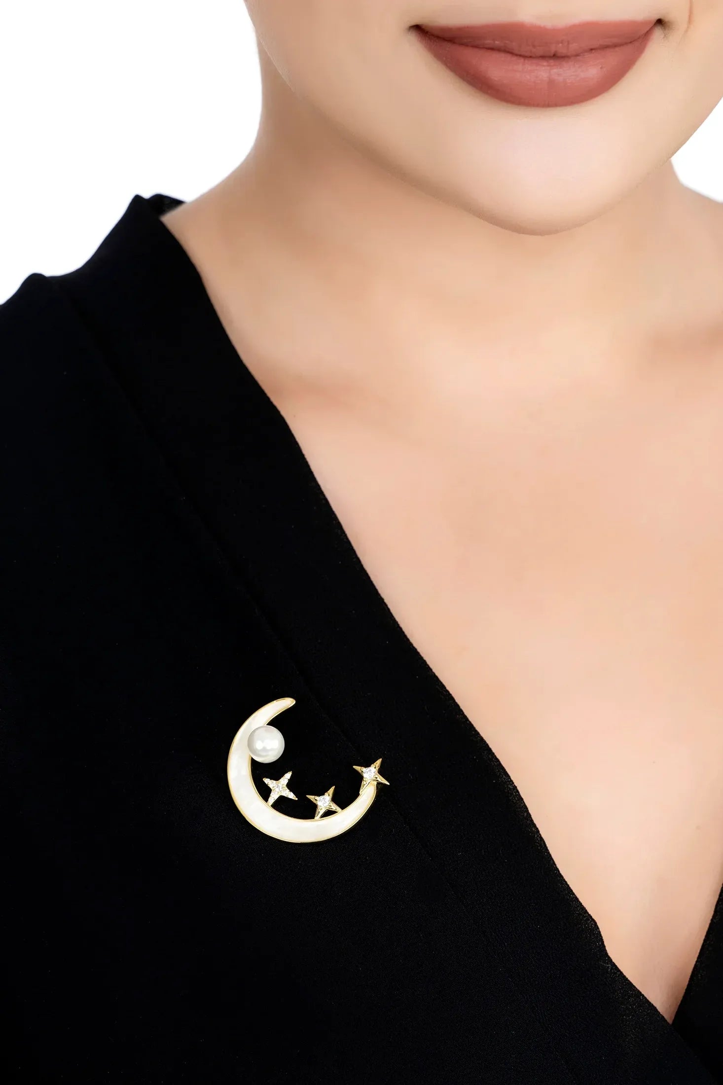 The brooch worn by a model.