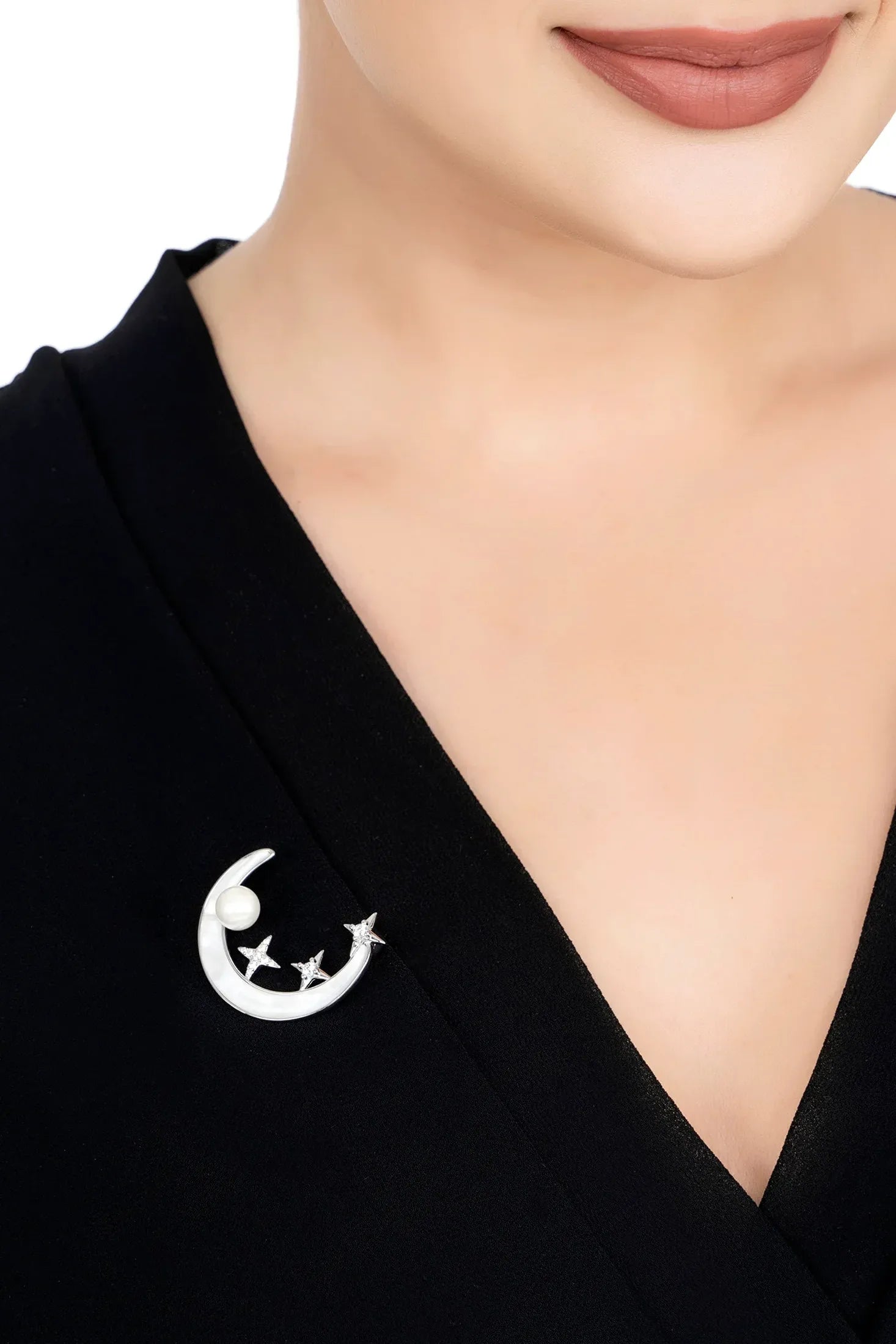 The brooch worn by a model.