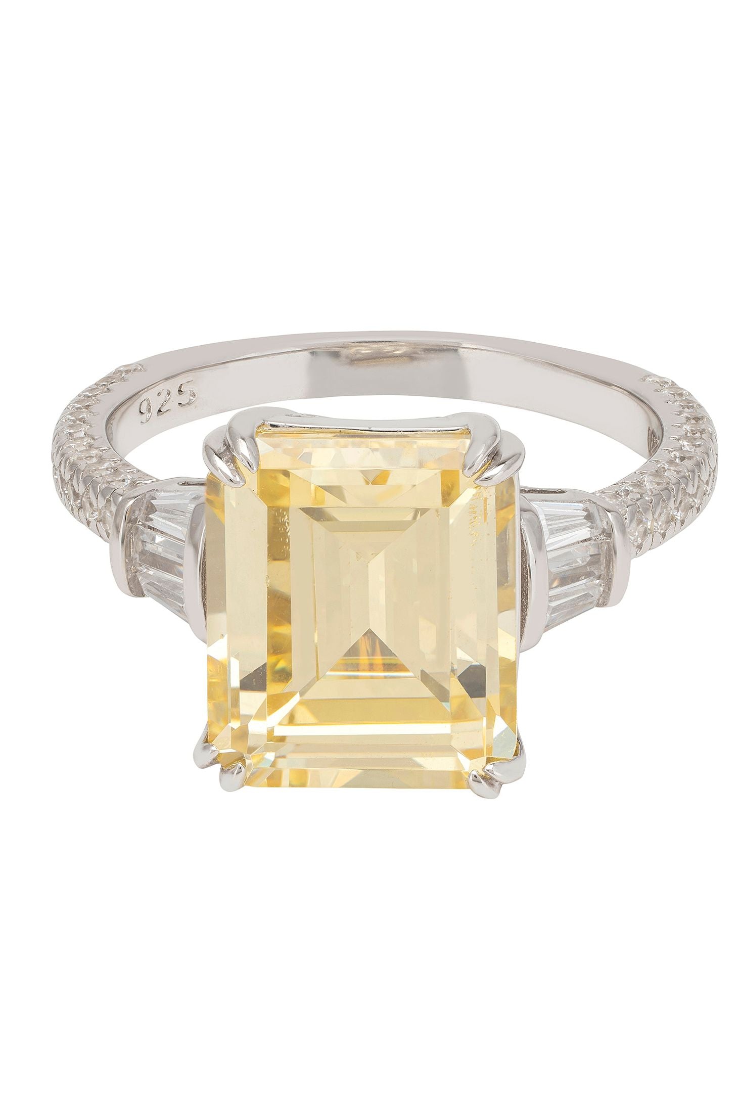 Ring with a yellow gemstone and silver band on a white background