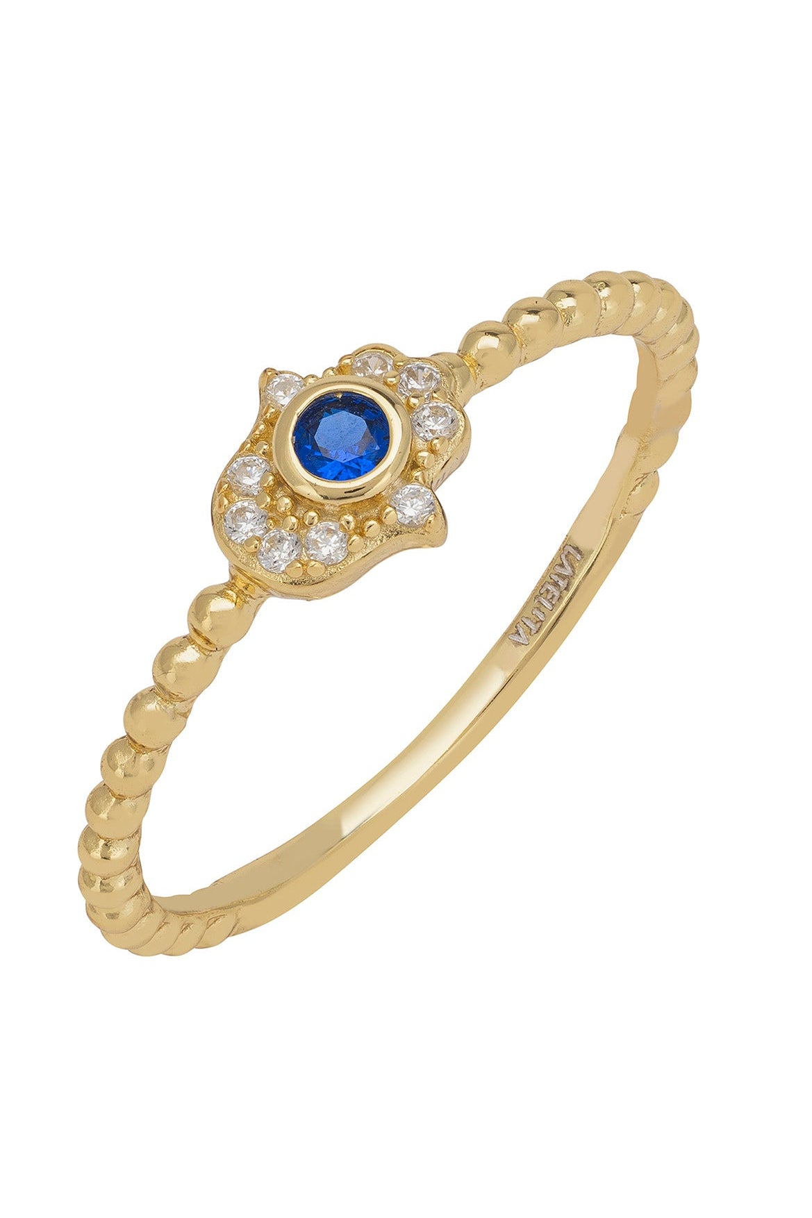 Gold ring with a blue gemstone and clear gemstone accents on a white background