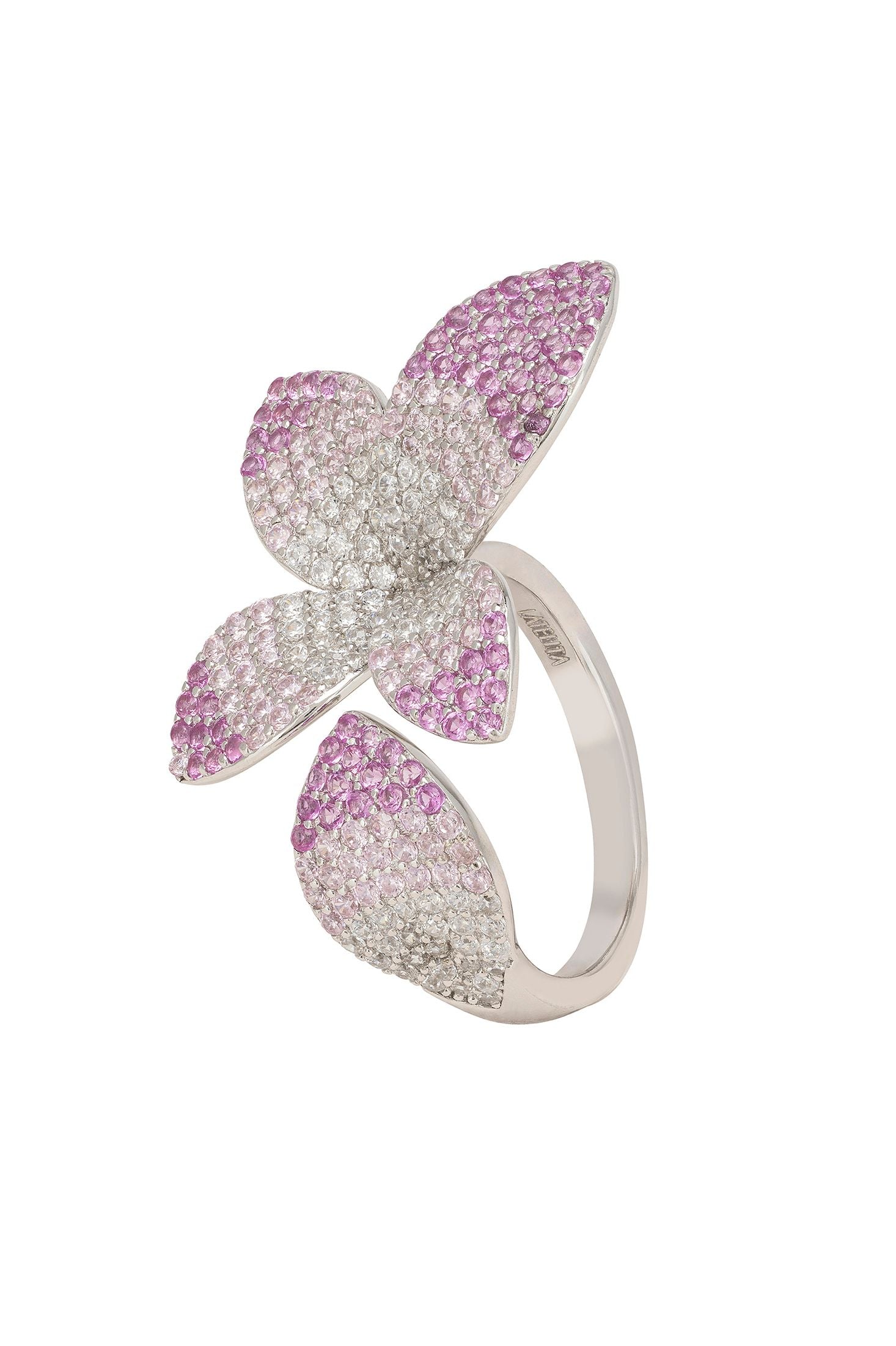 Silver ring with pink gemstone accents on a white background