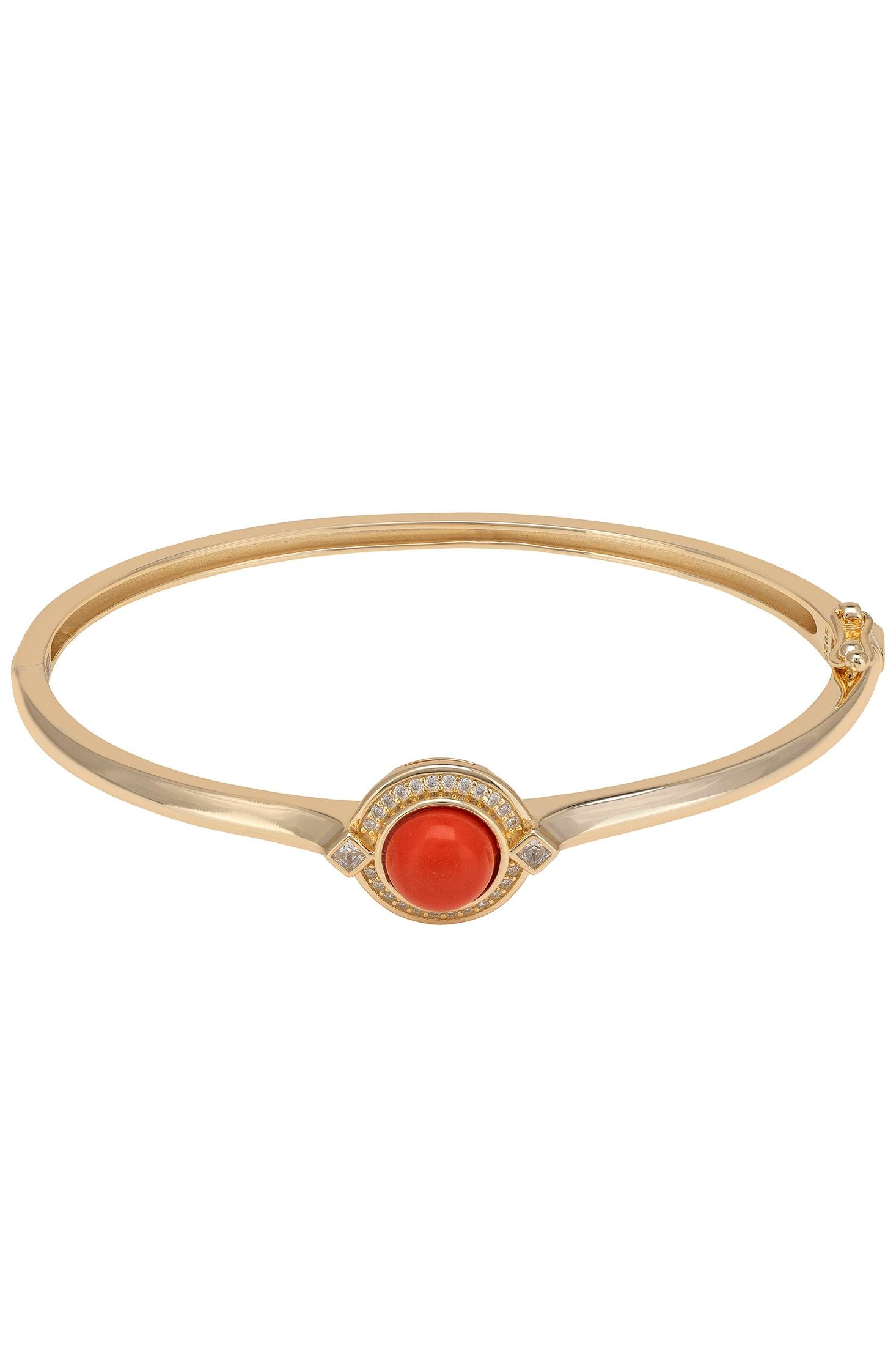 Gold bracelet with a red gemstone on a white background