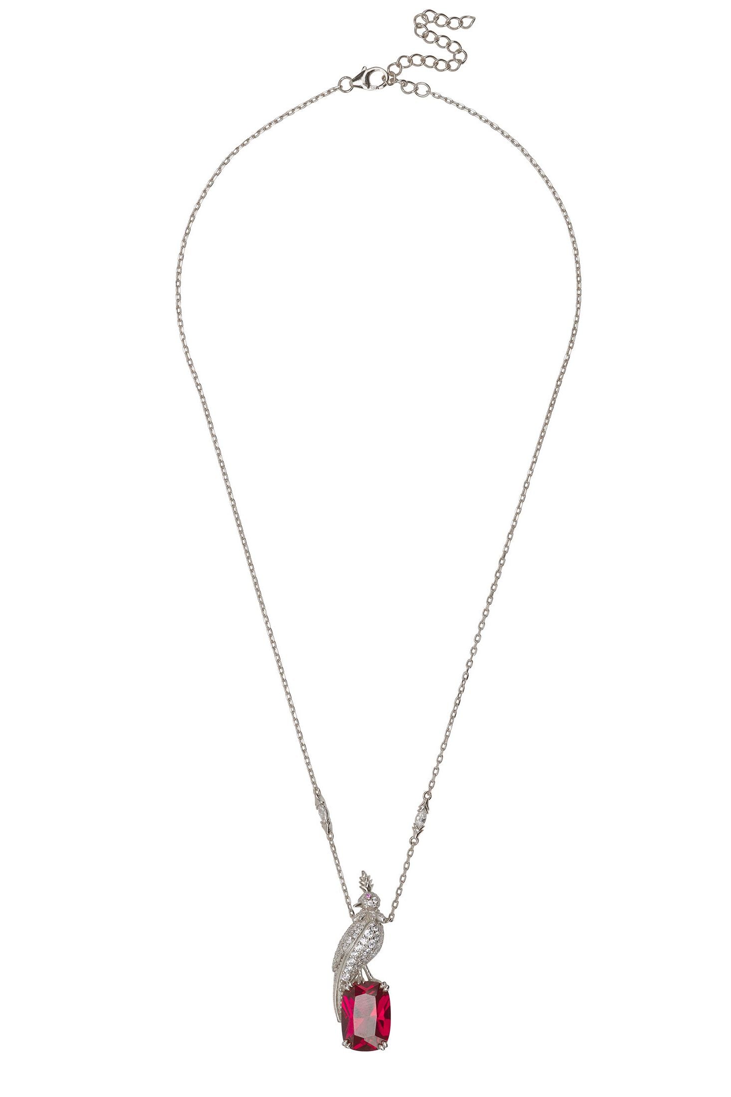 Angled view of Crested Love Bird Pendant Necklace Ruby Silver, showing bird design, ruby detailing, silver finish and the jewellery profile.