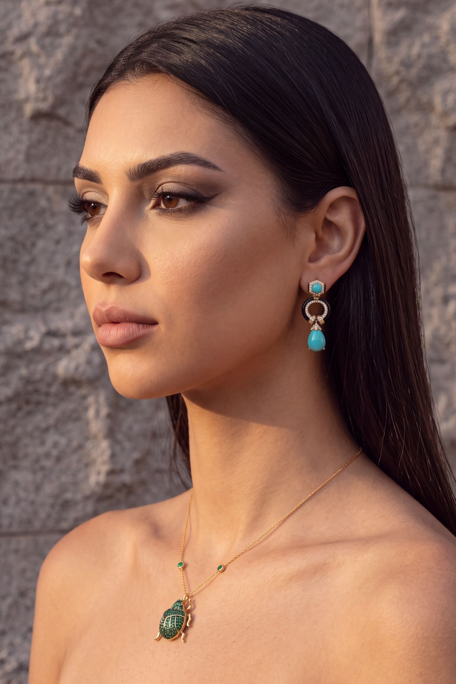 Angled view of Clara Bow Turquoise & Enamel Drop Earrings Gold, showing bow design, turquoise detailing, gold finish and the jewellery profile.