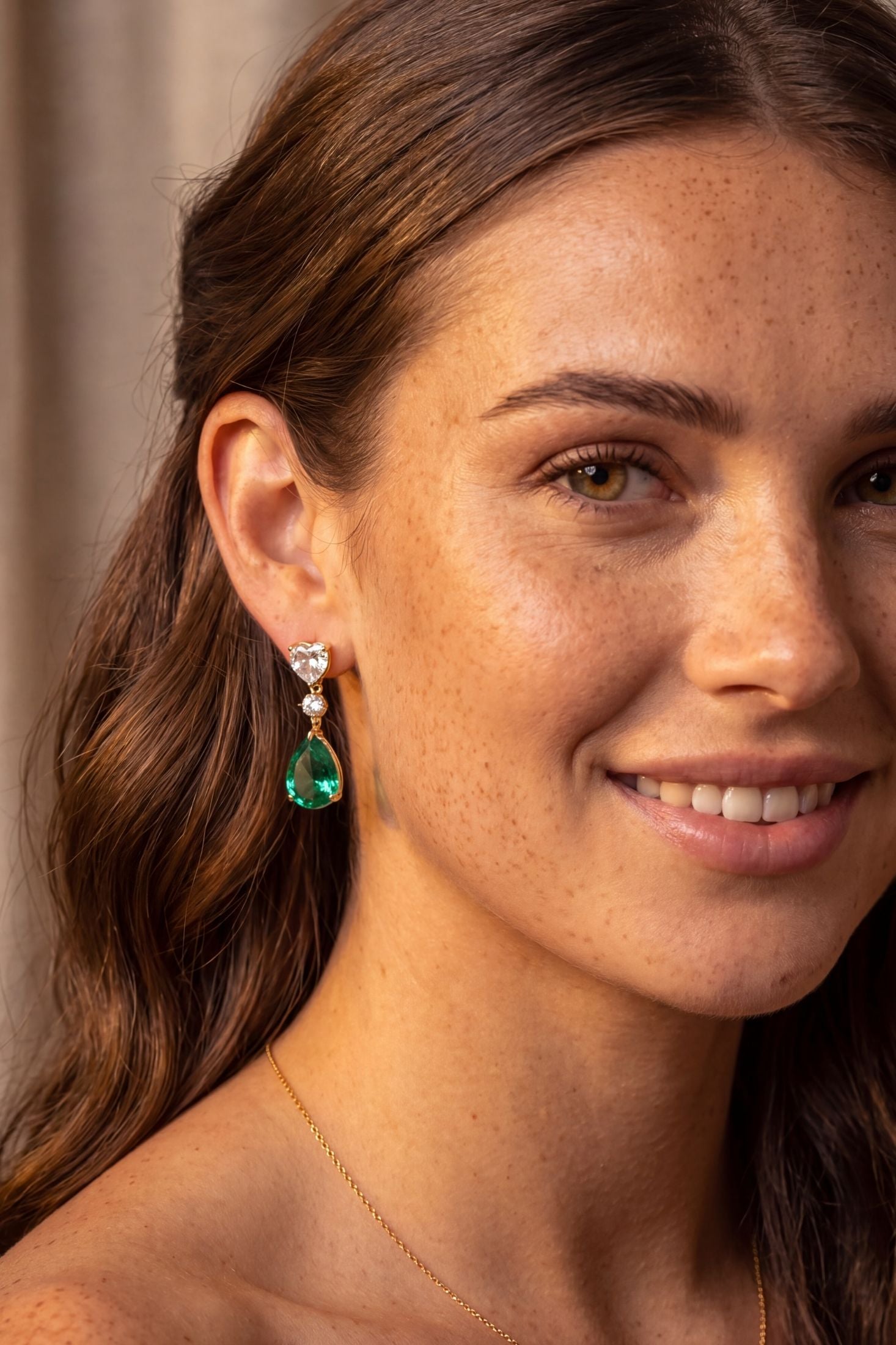 Close-up of Irina Paraiba Tourmaline Teardrop Earrings Gold, highlighting gold finish.