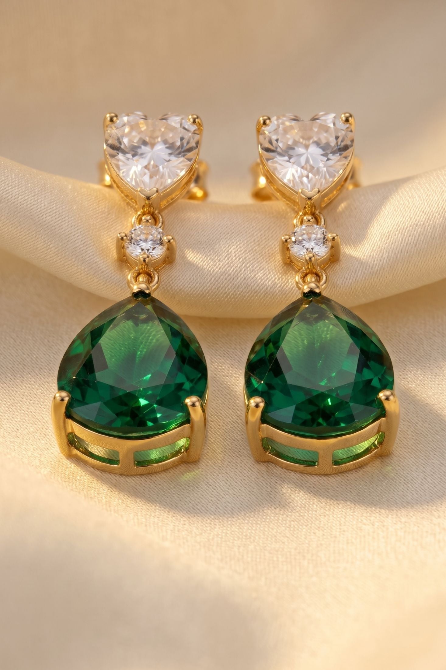 Close-up of Irina Paraiba Tourmaline Teardrop Earrings Gold, highlighting gold finish.