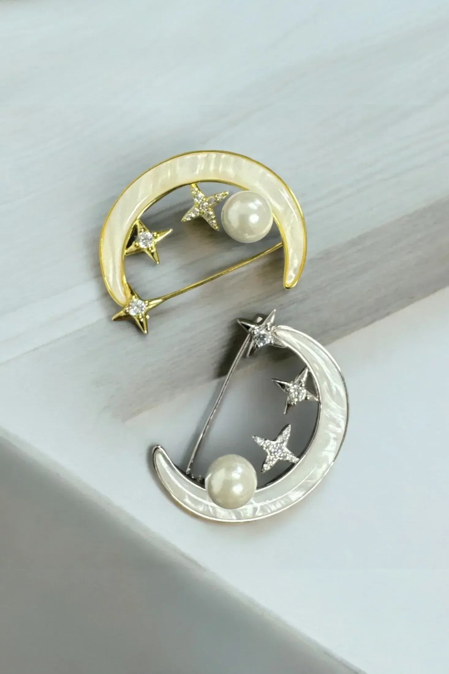 Still life of the gold and silver variation of the pins.