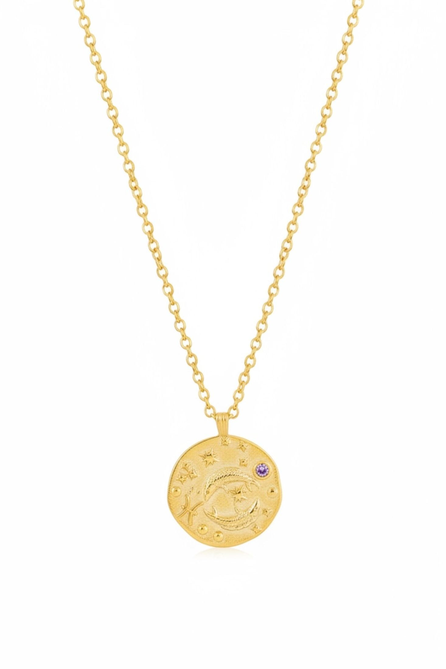 Gold necklace with a round pendant on a white background