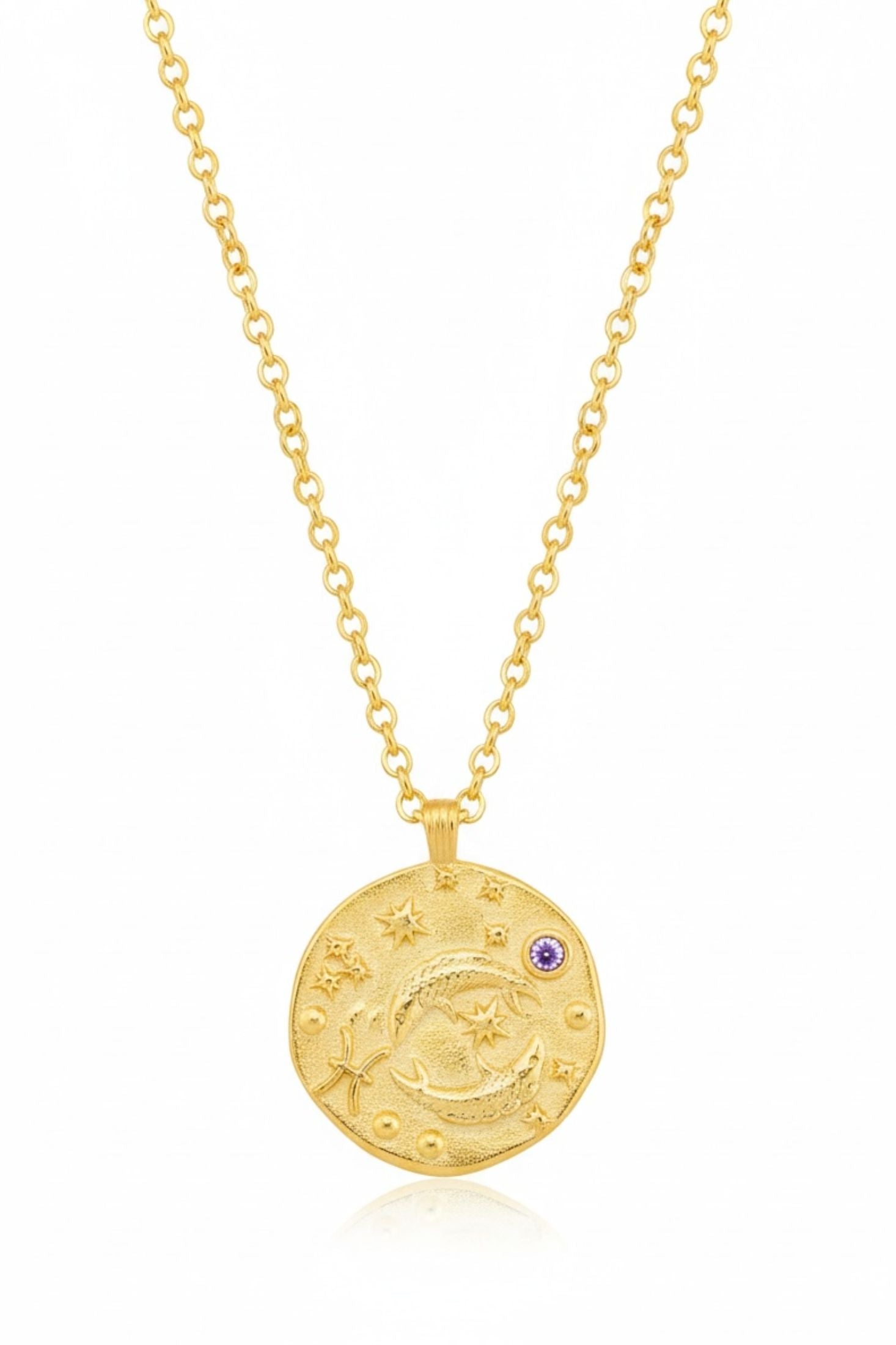 Gold necklace with a round pendant on a white background