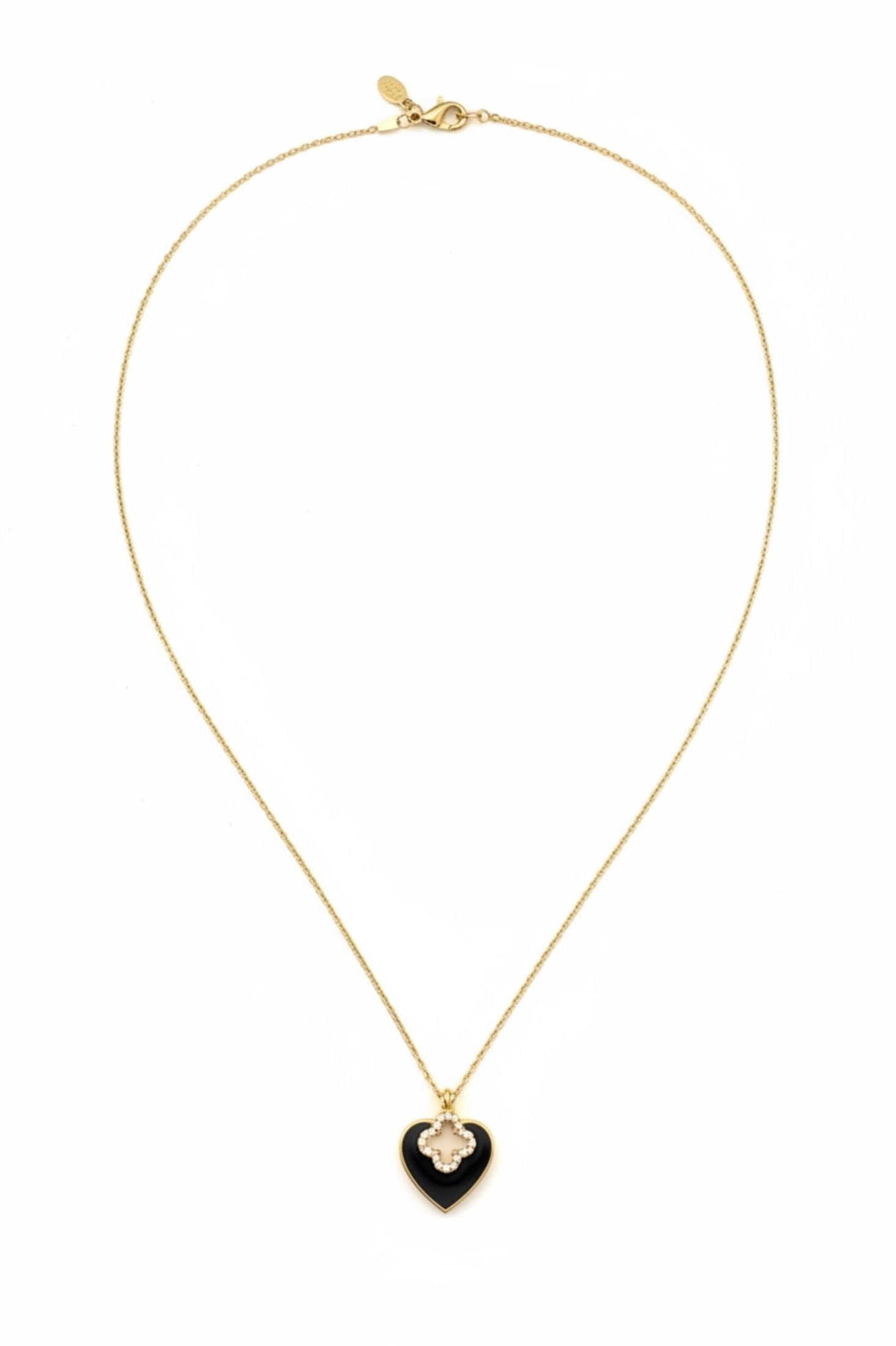 Gold necklace with a black heart-shaped pendant on a white background 