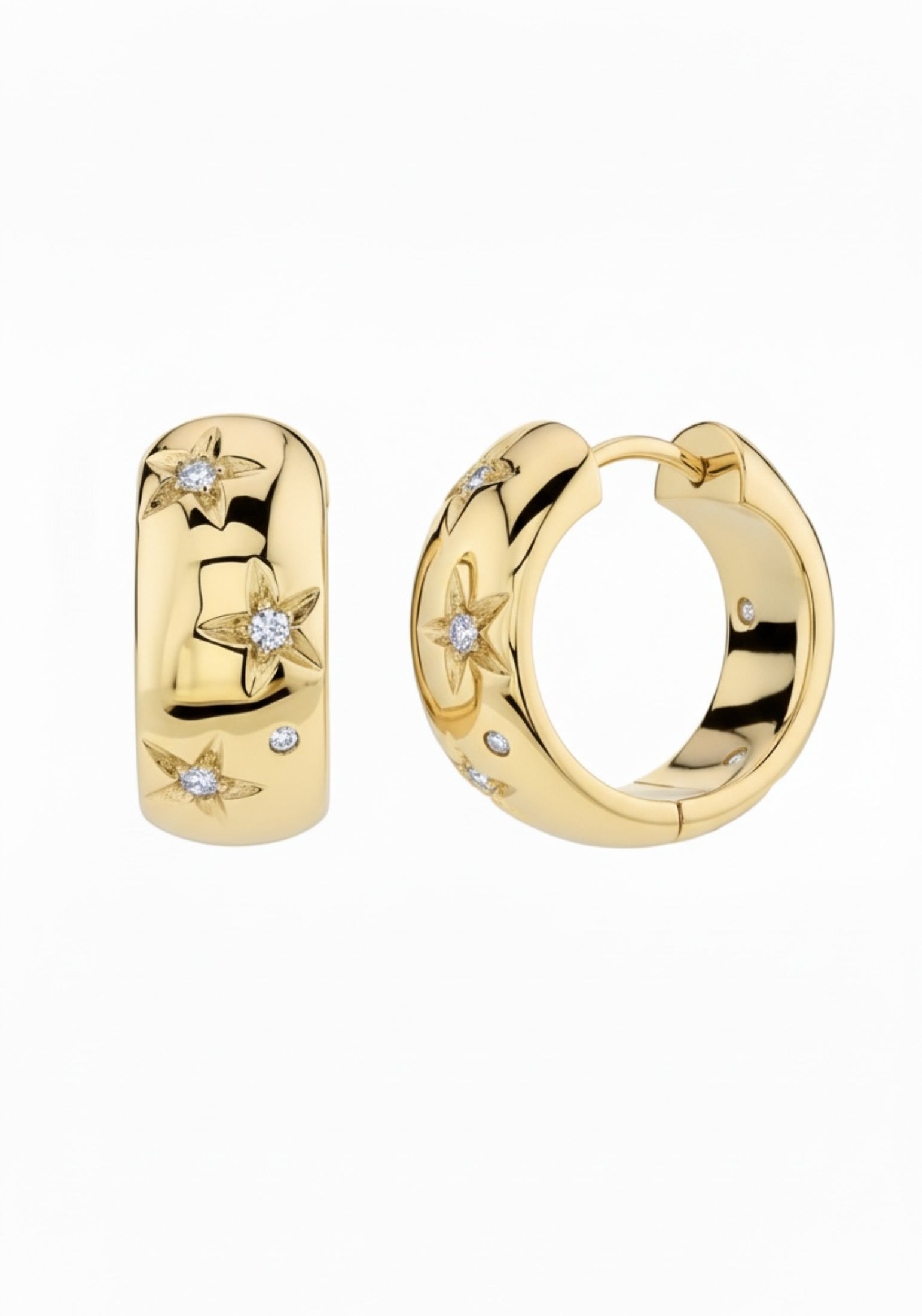 Gold hoop earrings with star designs and small diamonds on a white background