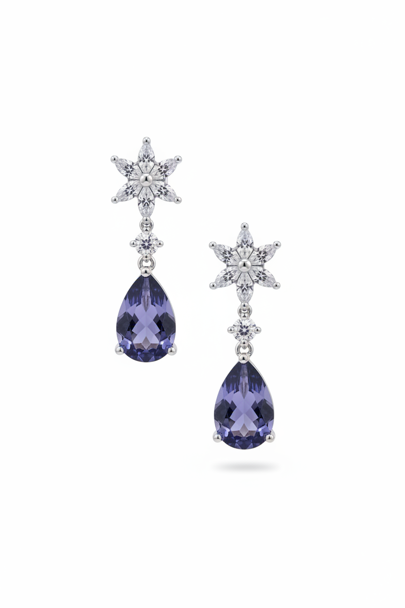 Angled view of Sunflower Tanzanite Drop Earrings Silver, showing flower design, tanzanite detailing, silver finish and the jewellery profile.