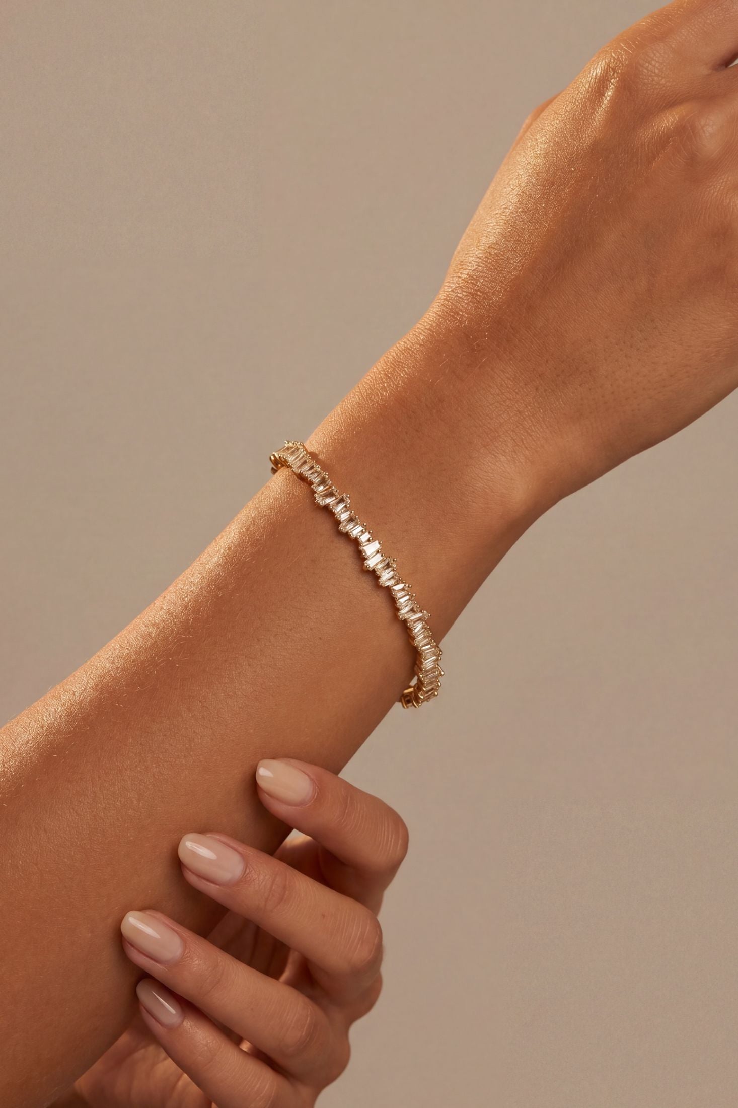 Close-up of Baguette Ice Cuff Bangle Gold White, highlighting gold finish.