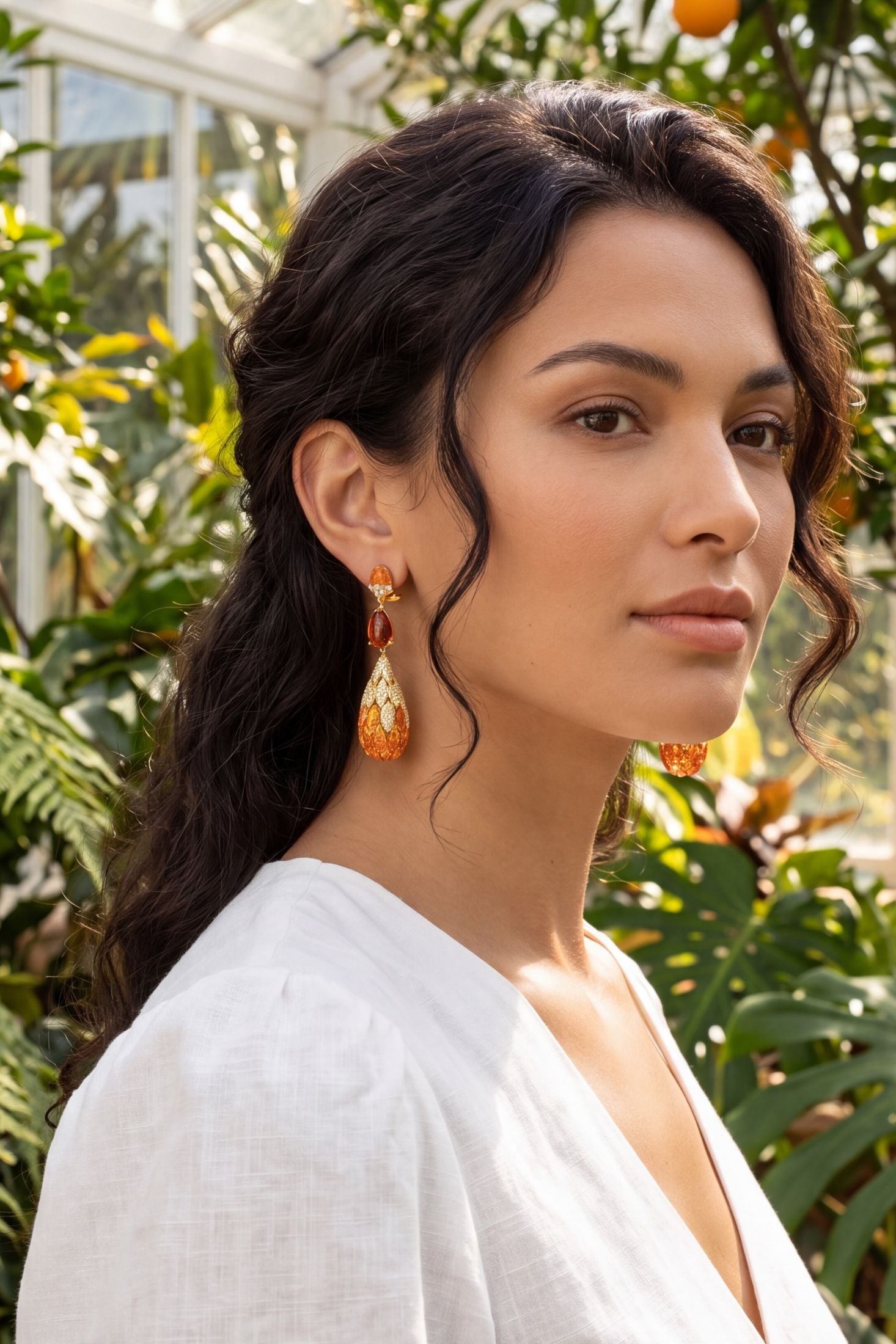 Angled view of Carmen Fire Opal Drop Earrings Gold, showing gold finish and the jewellery profile.