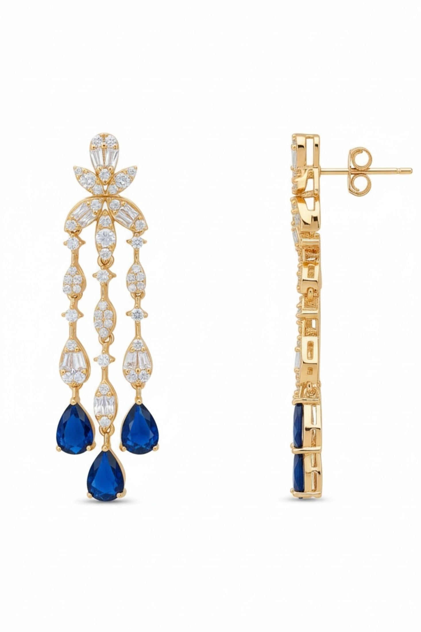 Gold earrings with blue gemstones on a white background