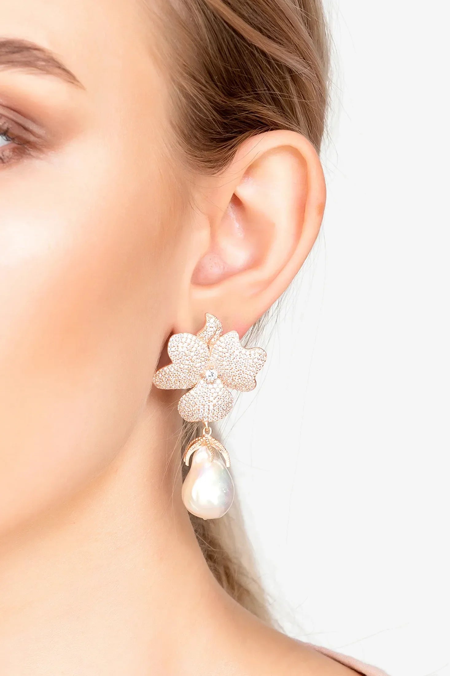 The earring worn by a model.