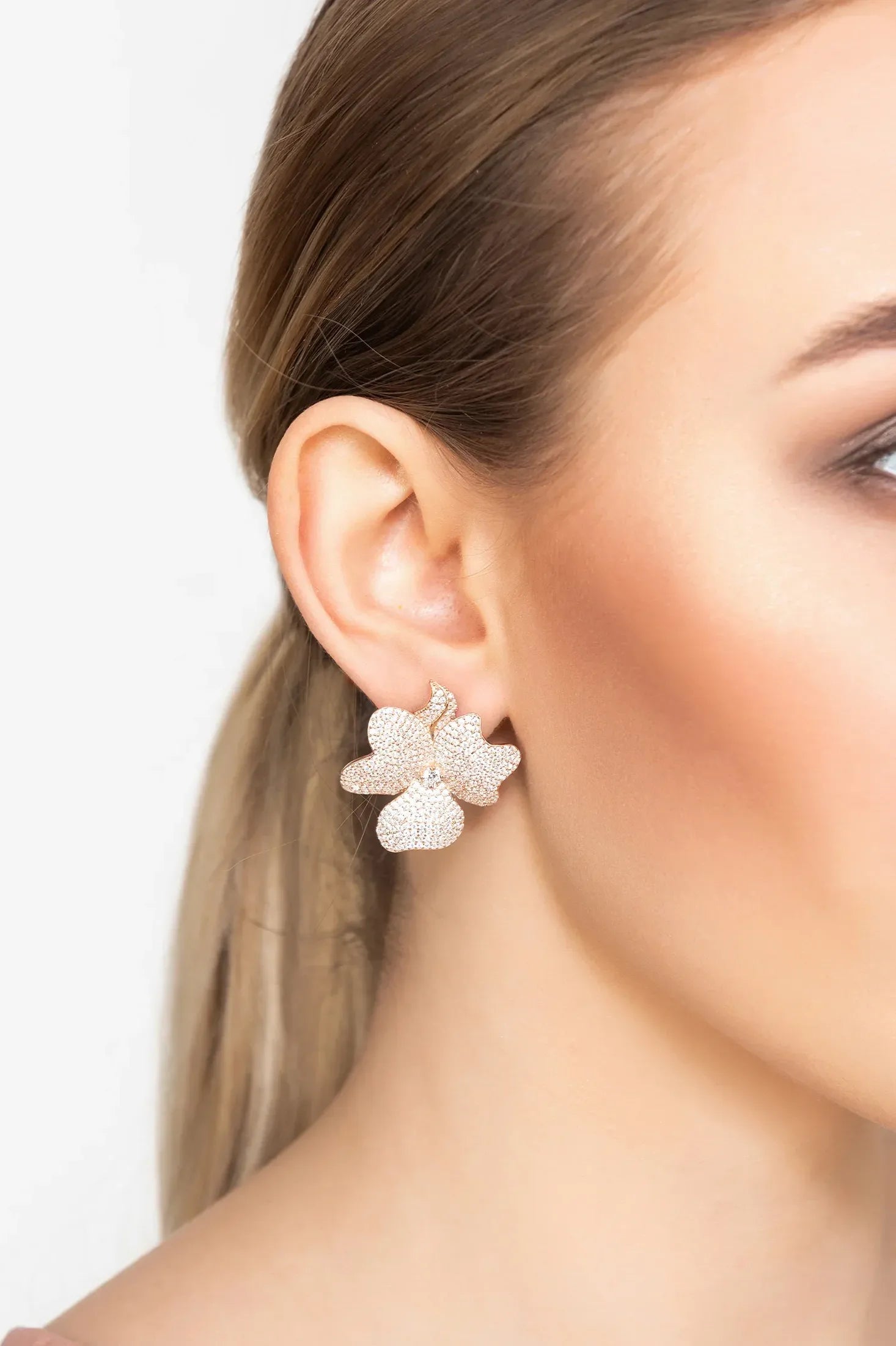 The earring worn by a model.