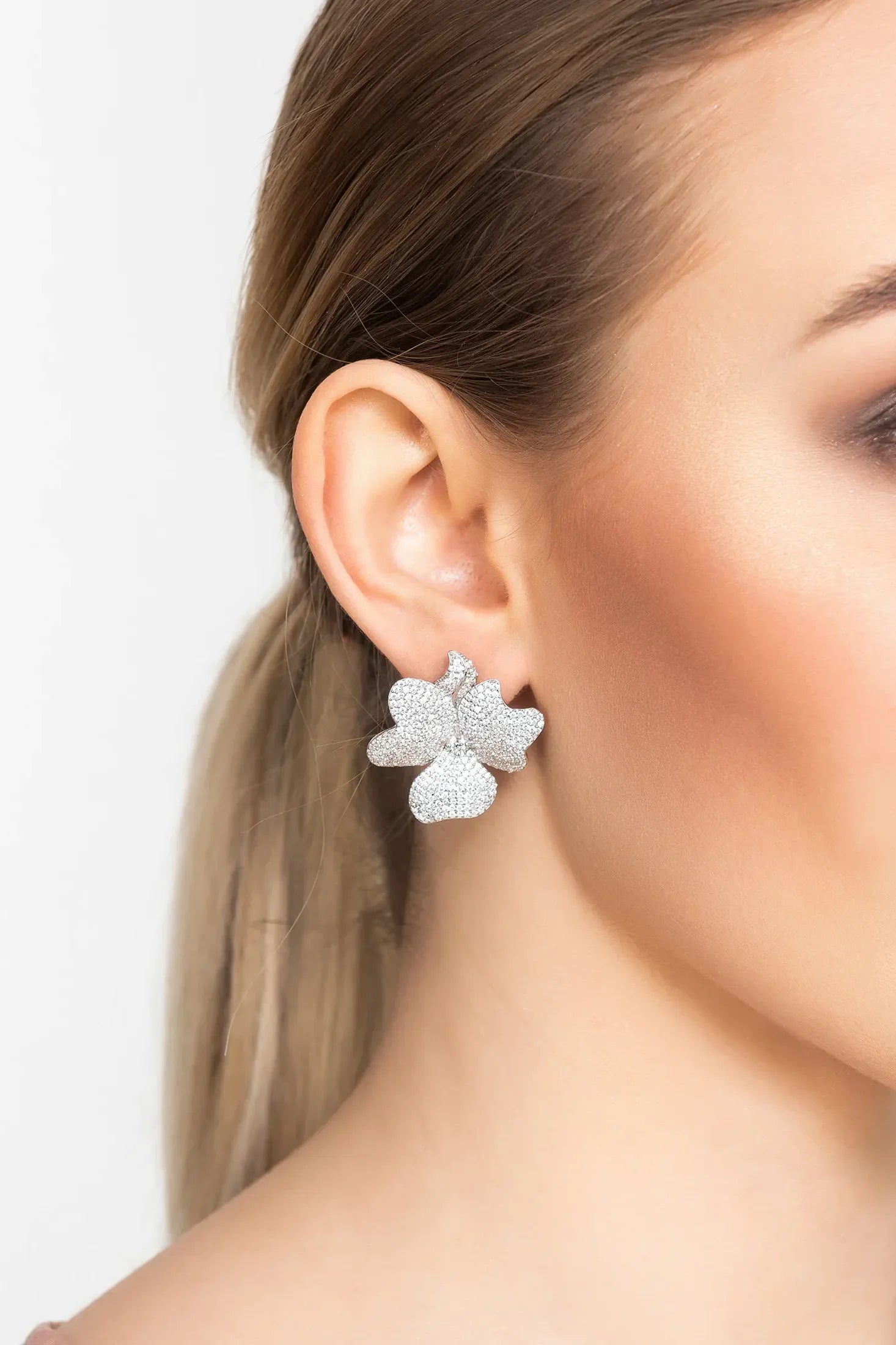 The earring worn by a model.