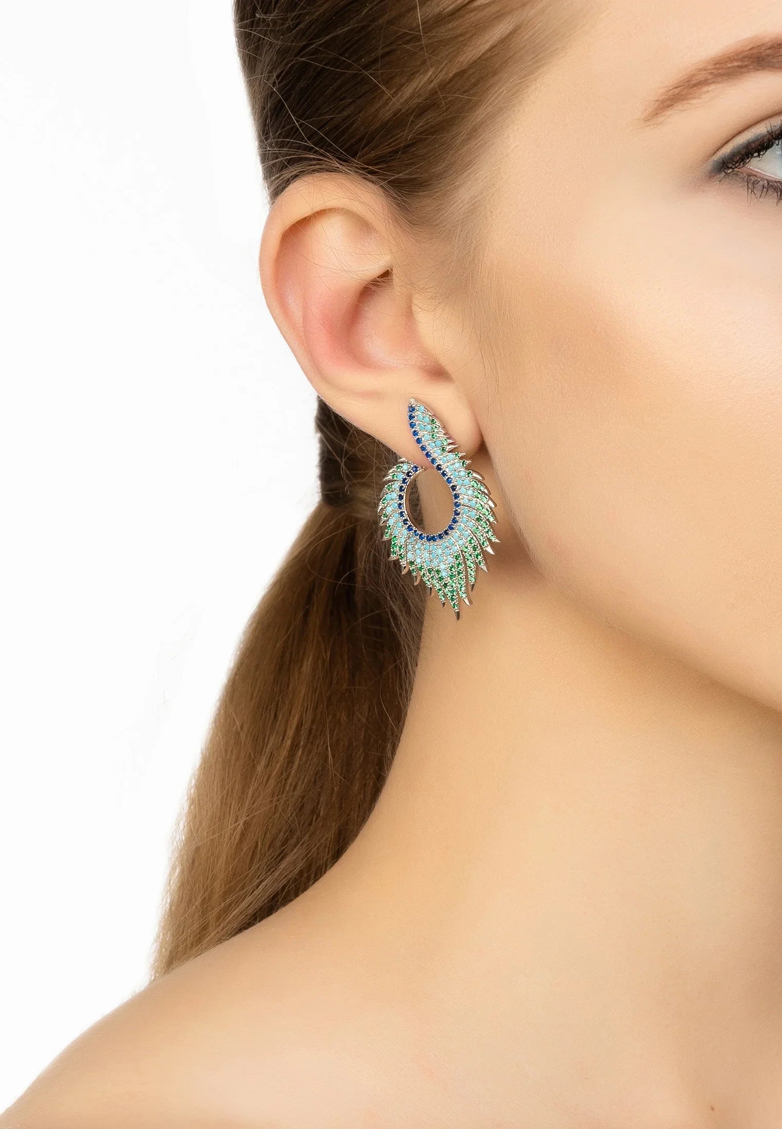 The earring worn by a model.