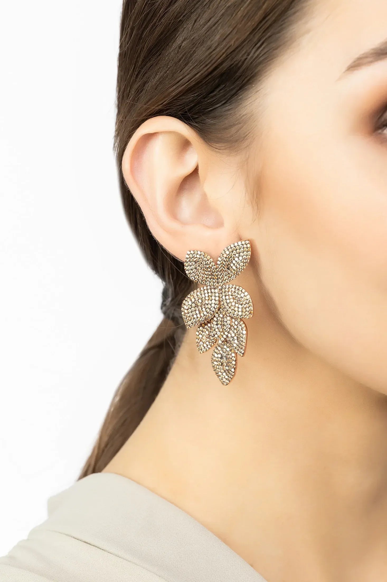 The earring worn by a model.