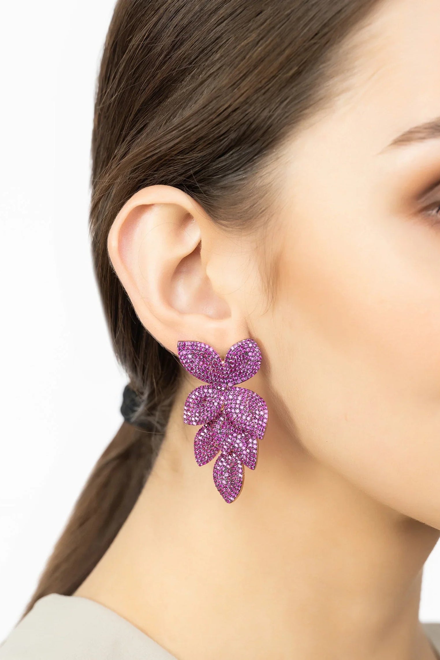 The earring worn by a model.